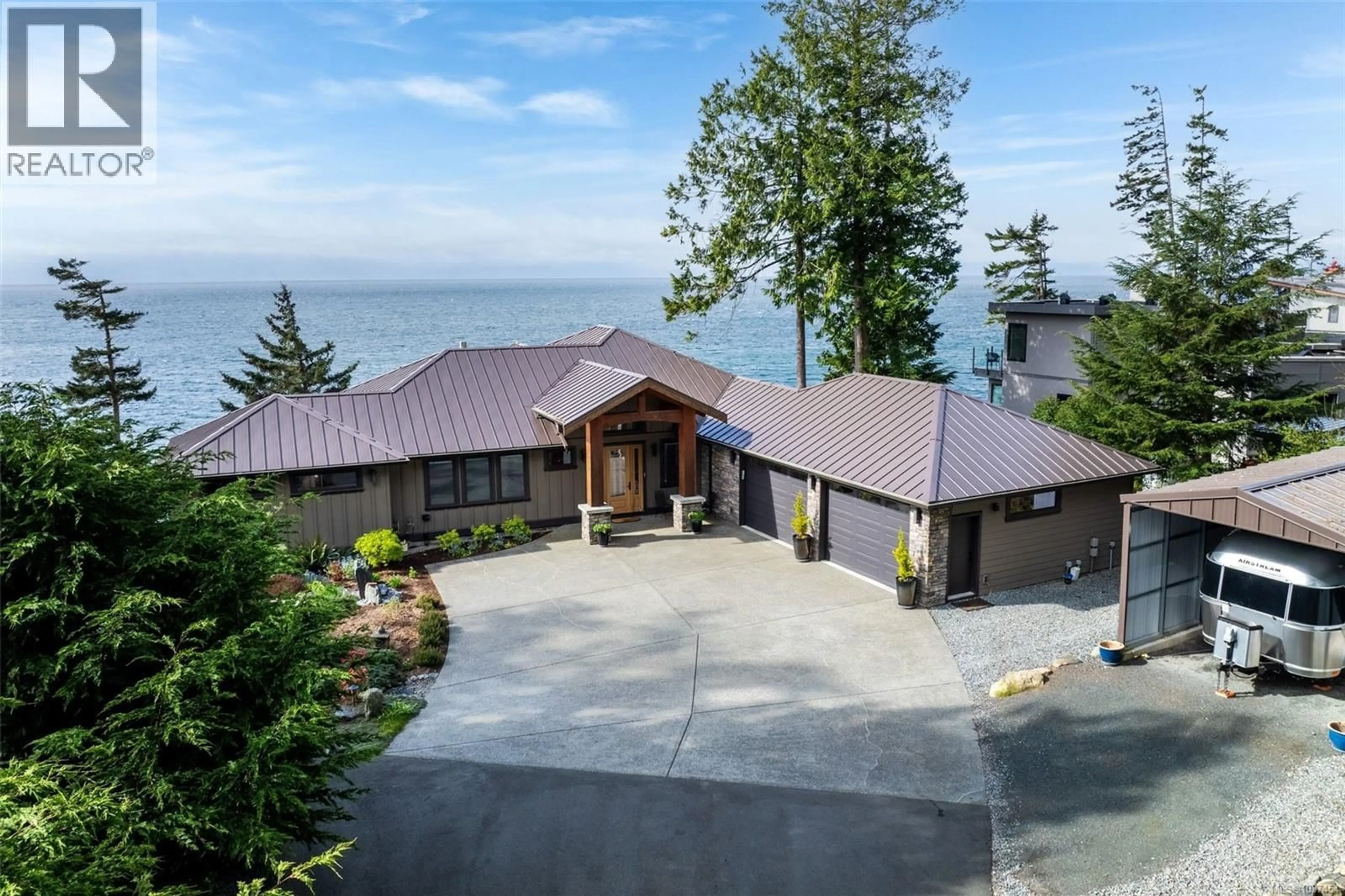 A pic from outside/outdoor area/front of a property/back of a property/a pic from drone, water/lake/river/ocean view for 2480 LIGHTHOUSE POINT ROAD, Sooke British Columbia V9Z1G7