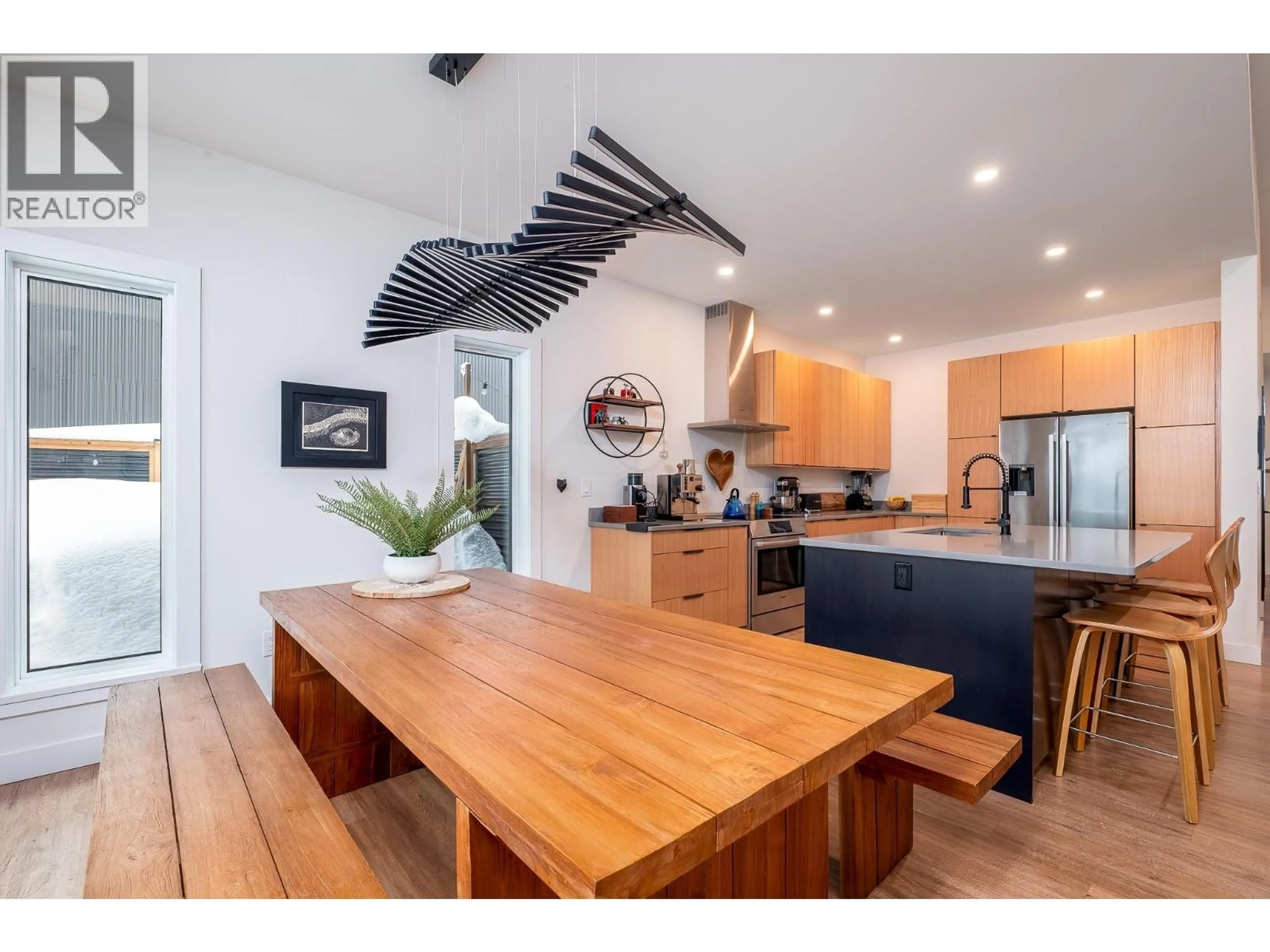 Open concept kitchen, wood/laminate floor for 1126 CALDERA ROAD, Rossland British Columbia V0G1Y0