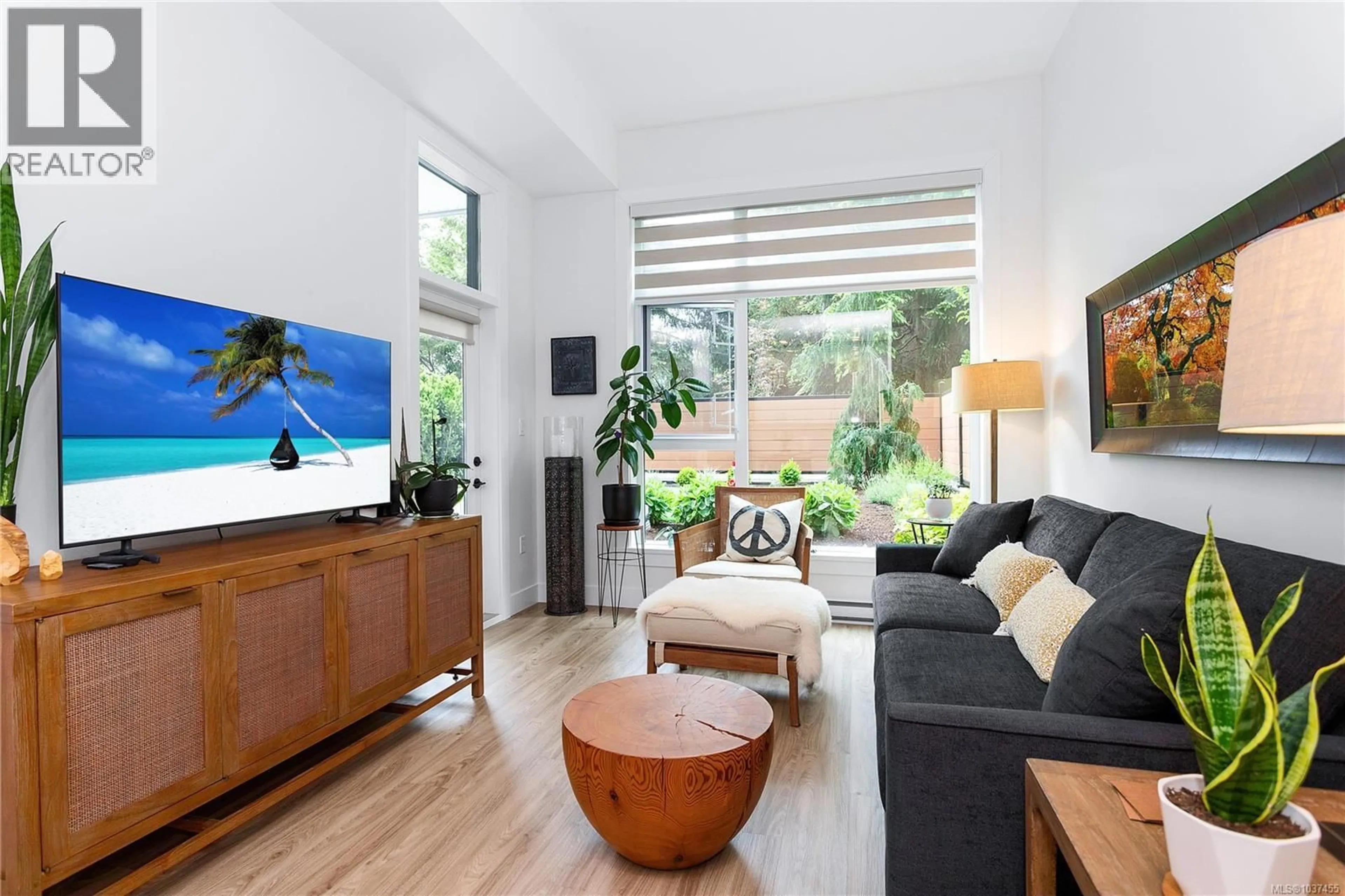 Living room with furniture, wood/laminate floor for 112 - 6320 SENTINAL DRIVE, Nanaimo British Columbia V9V0C1