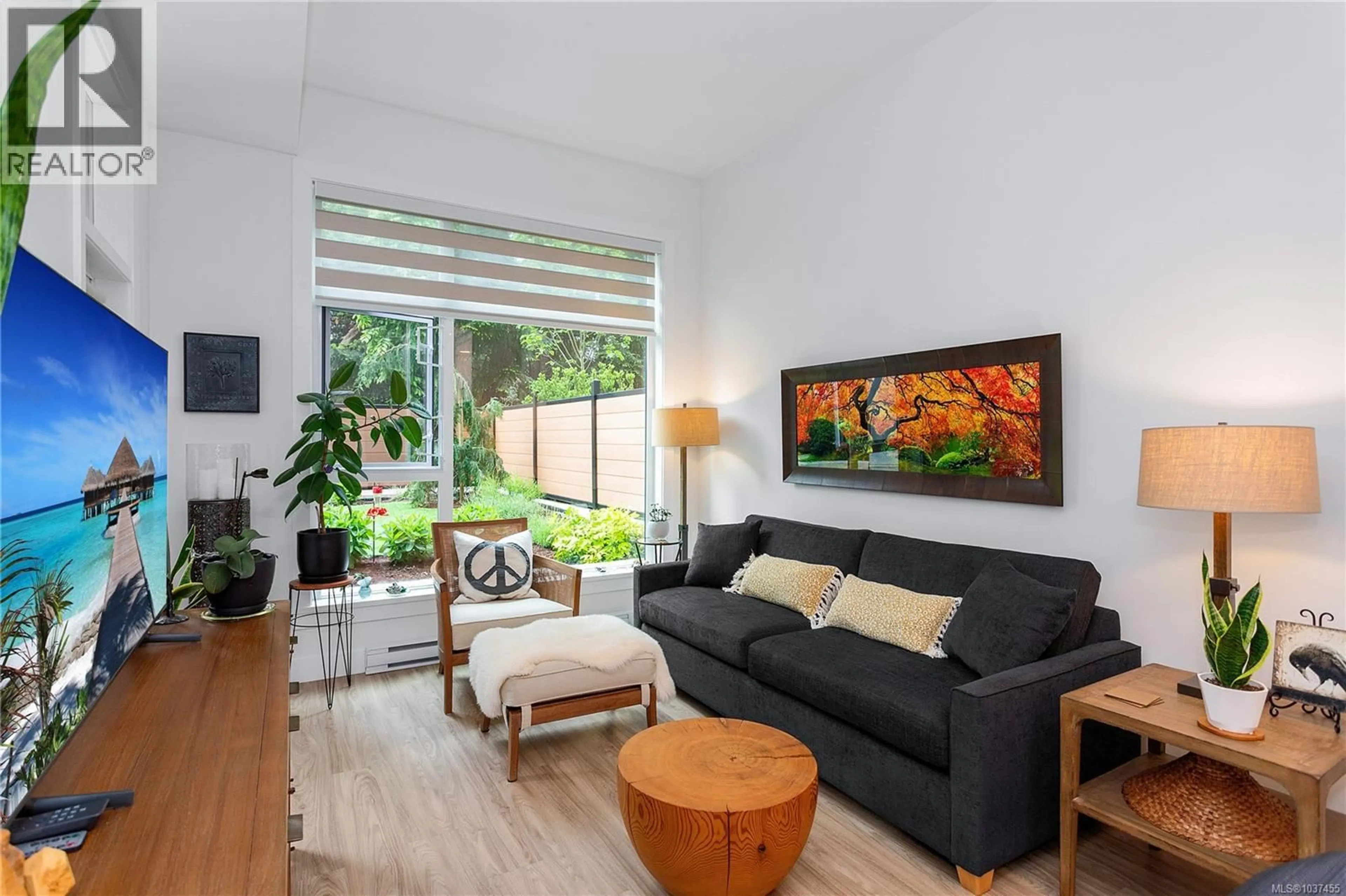 Living room with furniture, wood/laminate floor for 112 - 6320 SENTINAL DRIVE, Nanaimo British Columbia V9V0C1