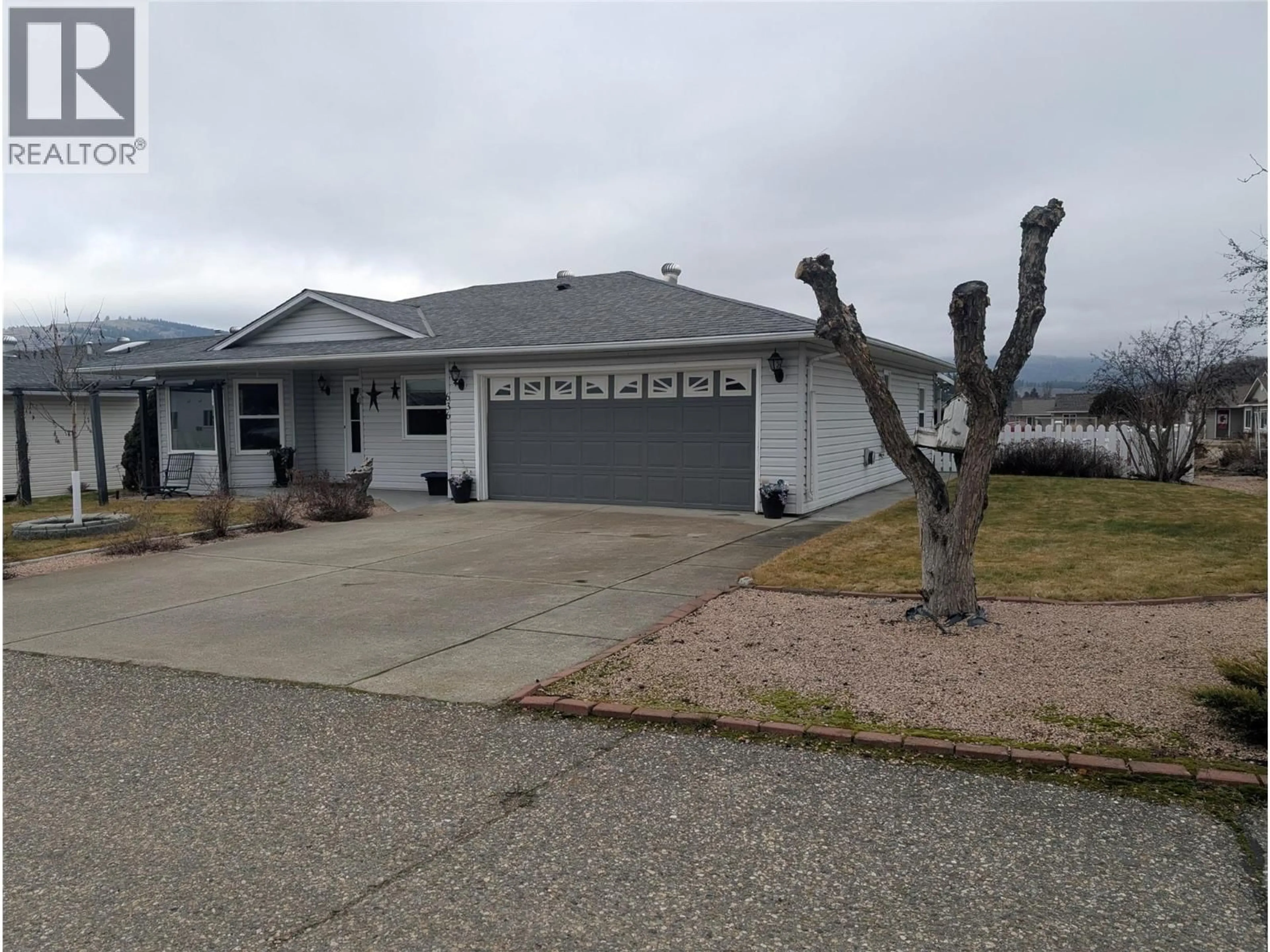 Home with vinyl exterior material, mountain view for 636 6TH AVENUE, Vernon British Columbia V1H1Z1