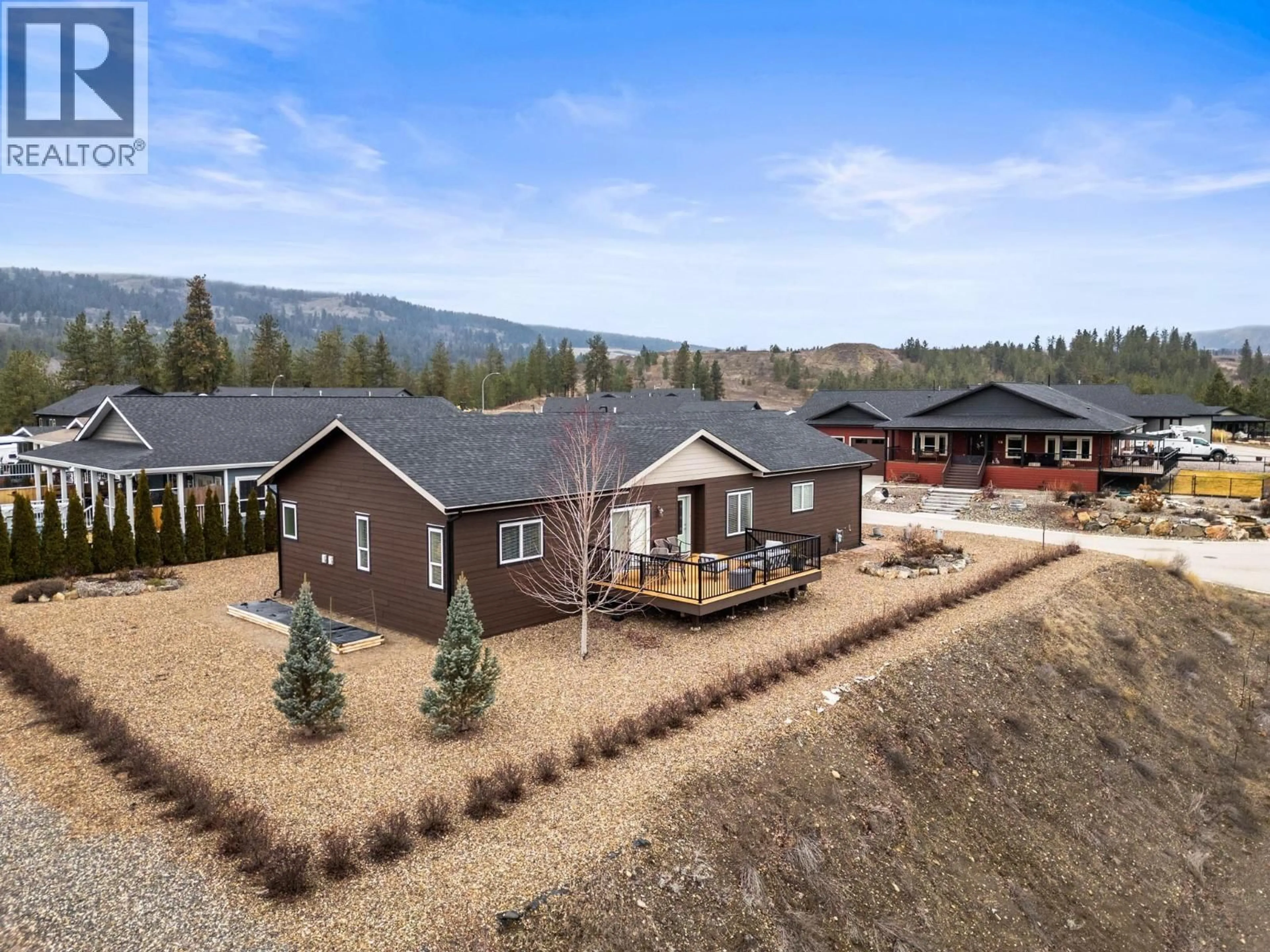 A pic from outside/outdoor area/front of a property/back of a property/a pic from drone, mountain view for 162 - 9510 HIGHWAY 97 N HIGHWAY, Vernon British Columbia V1H1R8