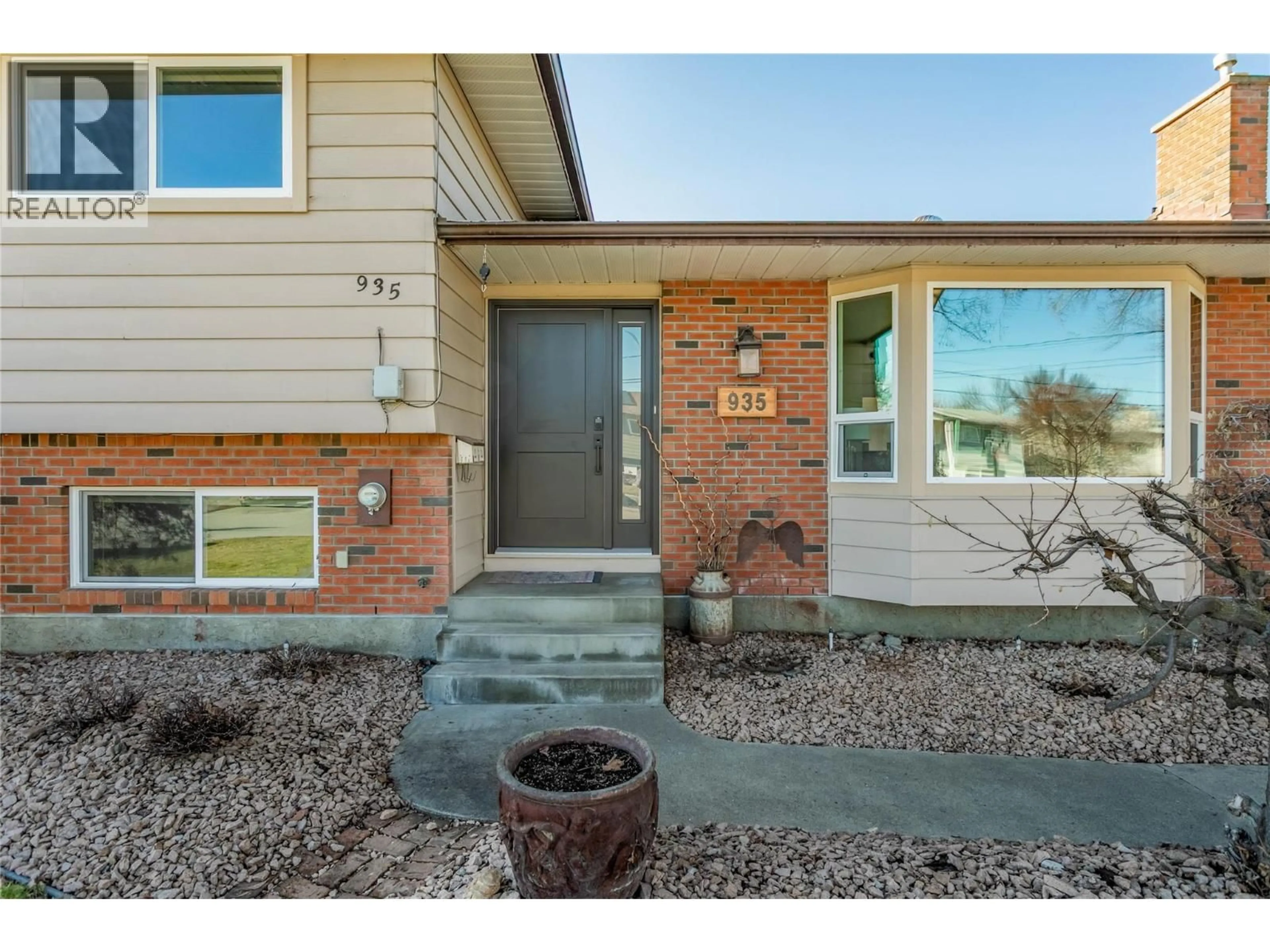 Home with brick exterior material, street for 935 HICKORY ROAD, Kelowna British Columbia V1X4K8