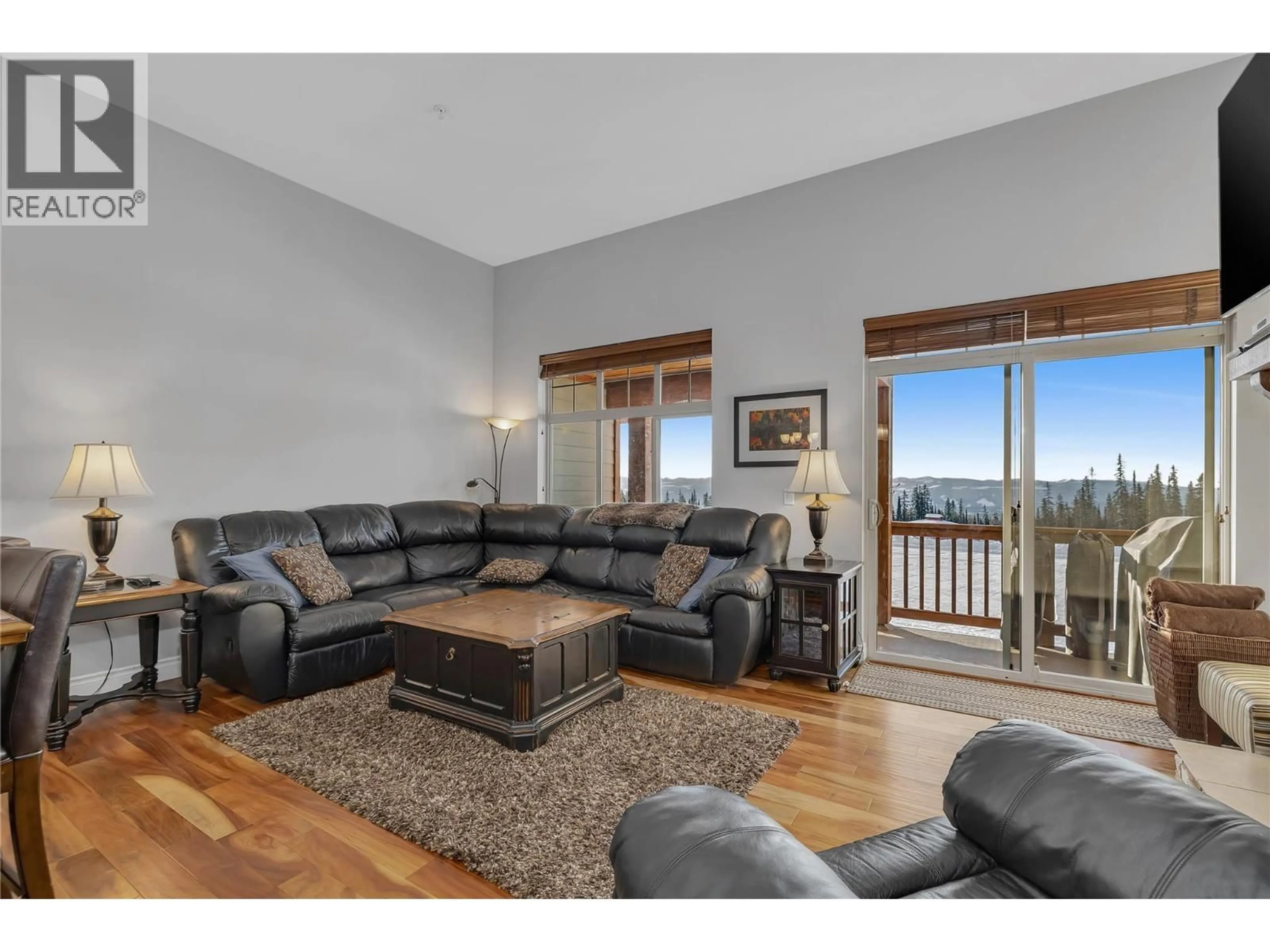 Living room with furniture, wood/laminate floor for 5 - 5045 SNOWBIRD WAY, Big White British Columbia V1P1P3