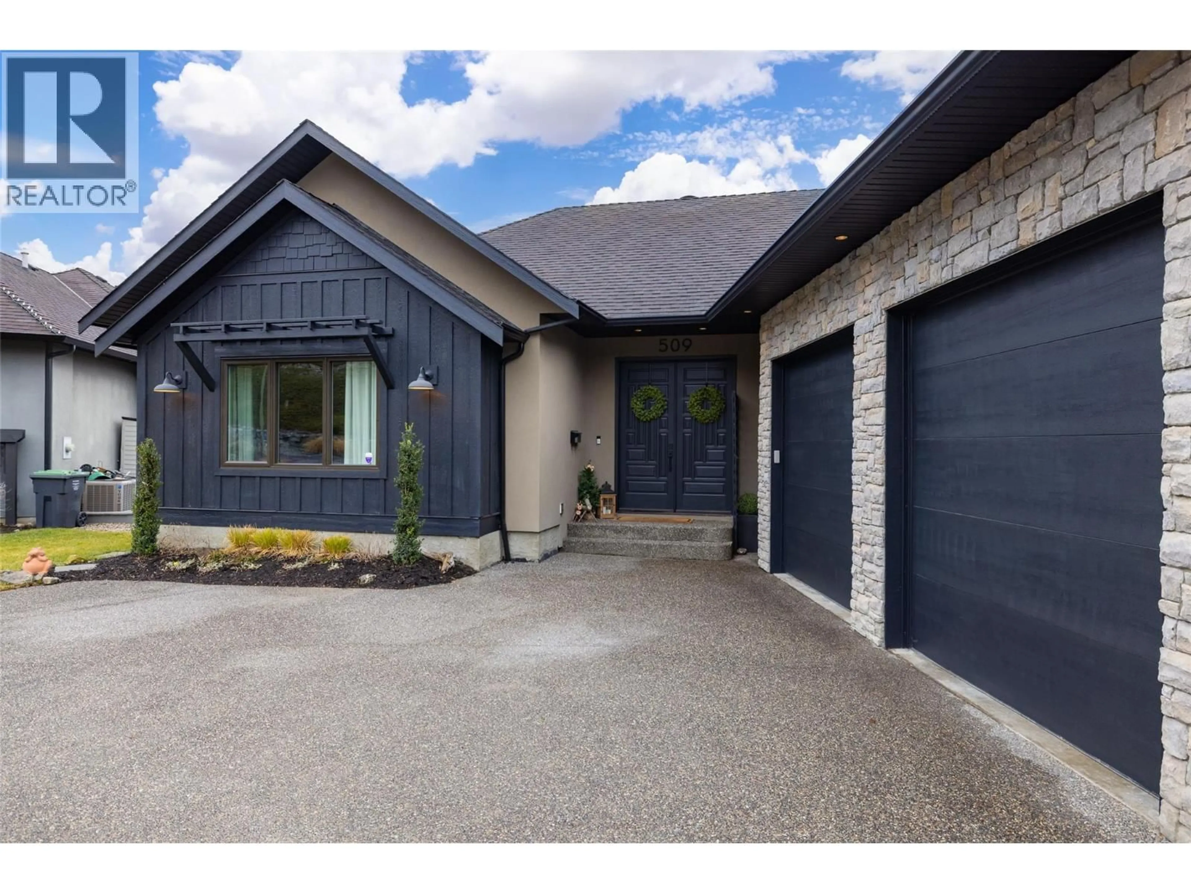 Home with brick exterior material, street for 509 CARAMILLO COURT, Kelowna British Columbia V1V2K9