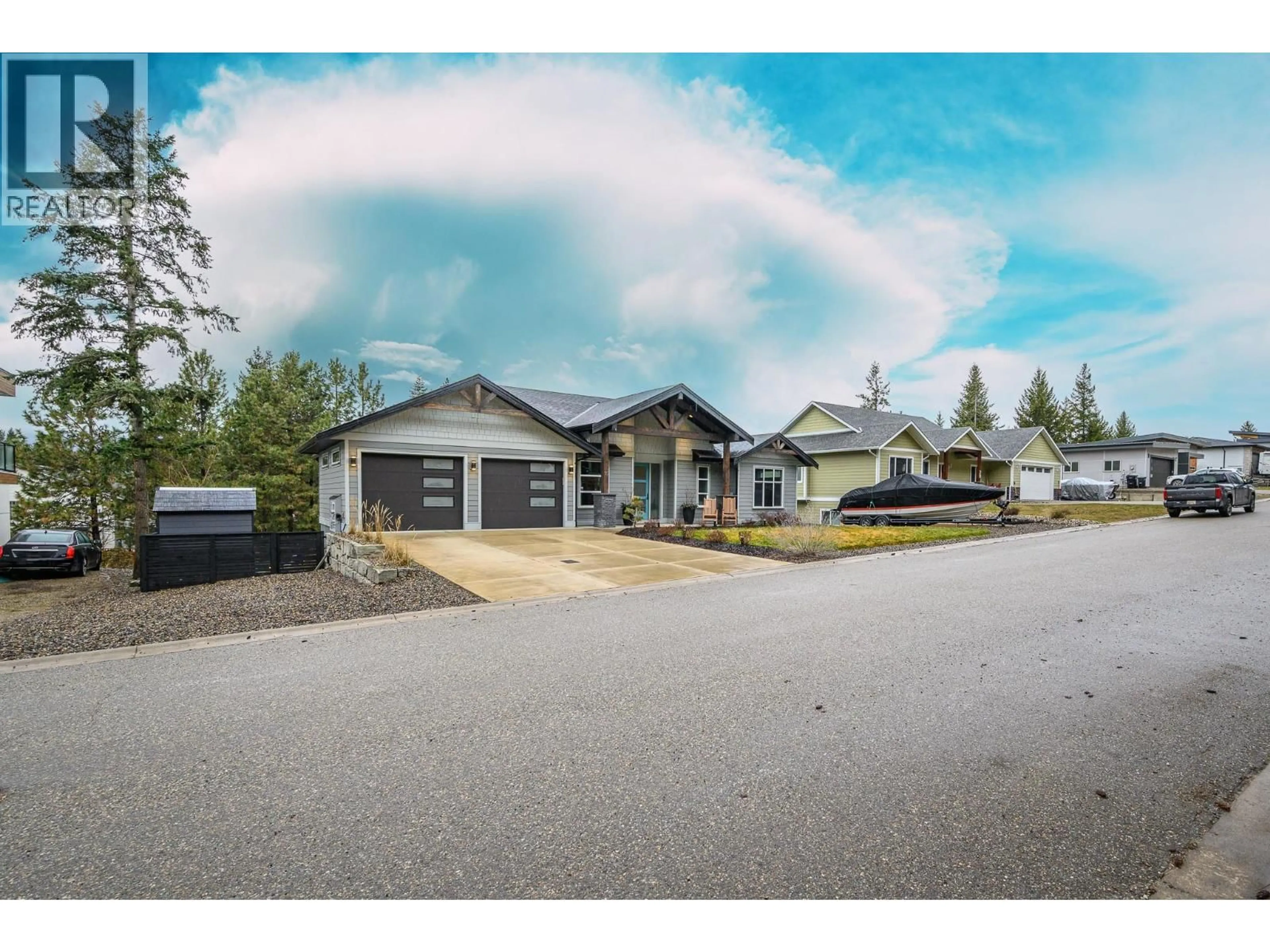 A pic from outside/outdoor area/front of a property/back of a property/a pic from drone, street for 16 GARMISCH ROAD, Vernon British Columbia V1H1E3
