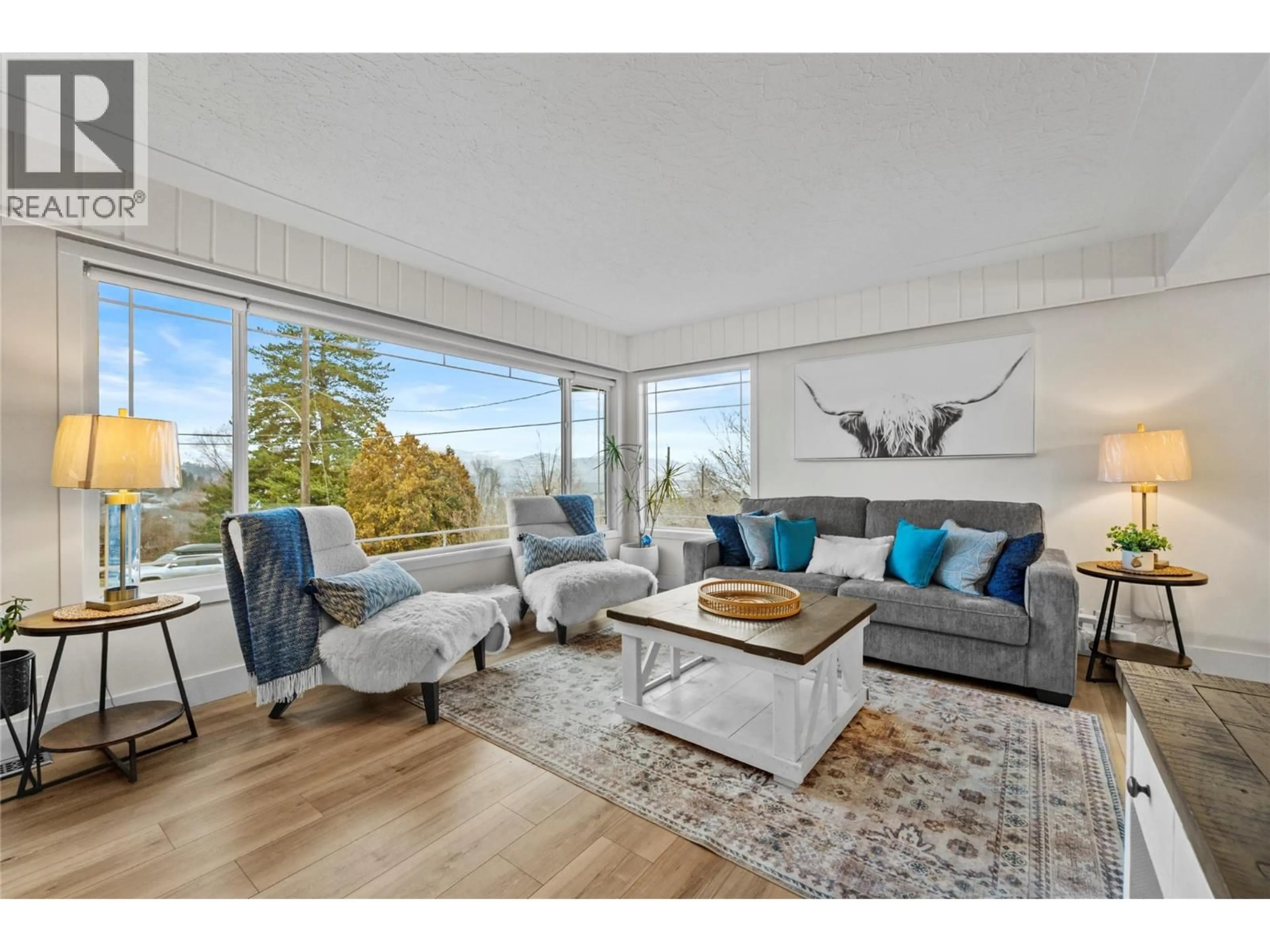 Living room with furniture, wood/laminate floor for 1515 ROBINSON CRESCENT, Kamloops British Columbia V2C3J2