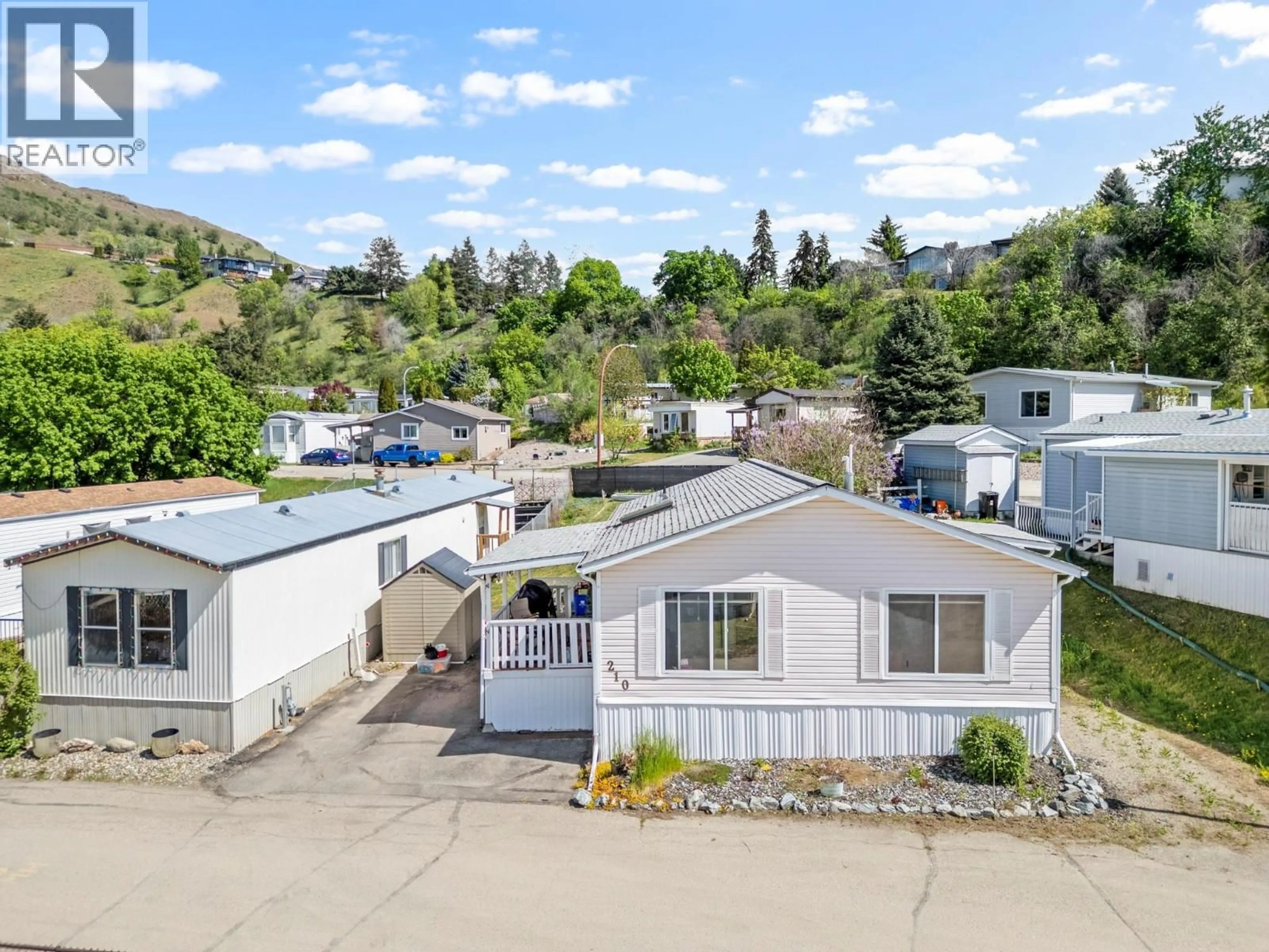 A pic from outside/outdoor area/front of a property/back of a property/a pic from drone, street for 210 - 15401 KALAMALKA LAKE ROAD, Coldstream British Columbia V1B1Z3