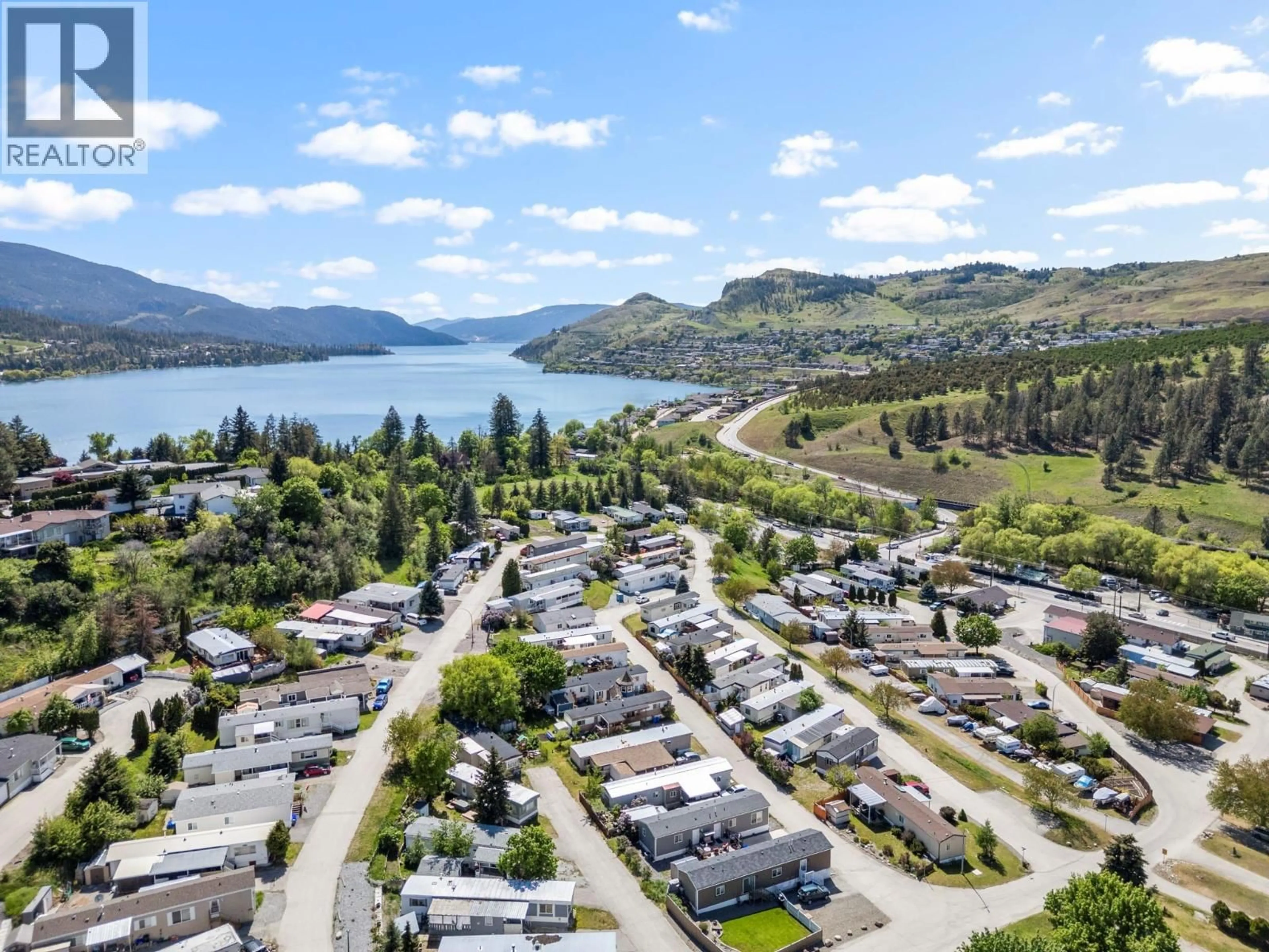 A pic from outside/outdoor area/front of a property/back of a property/a pic from drone, water/lake/river/ocean view for 210 - 15401 KALAMALKA LAKE ROAD, Coldstream British Columbia V1B1Z3