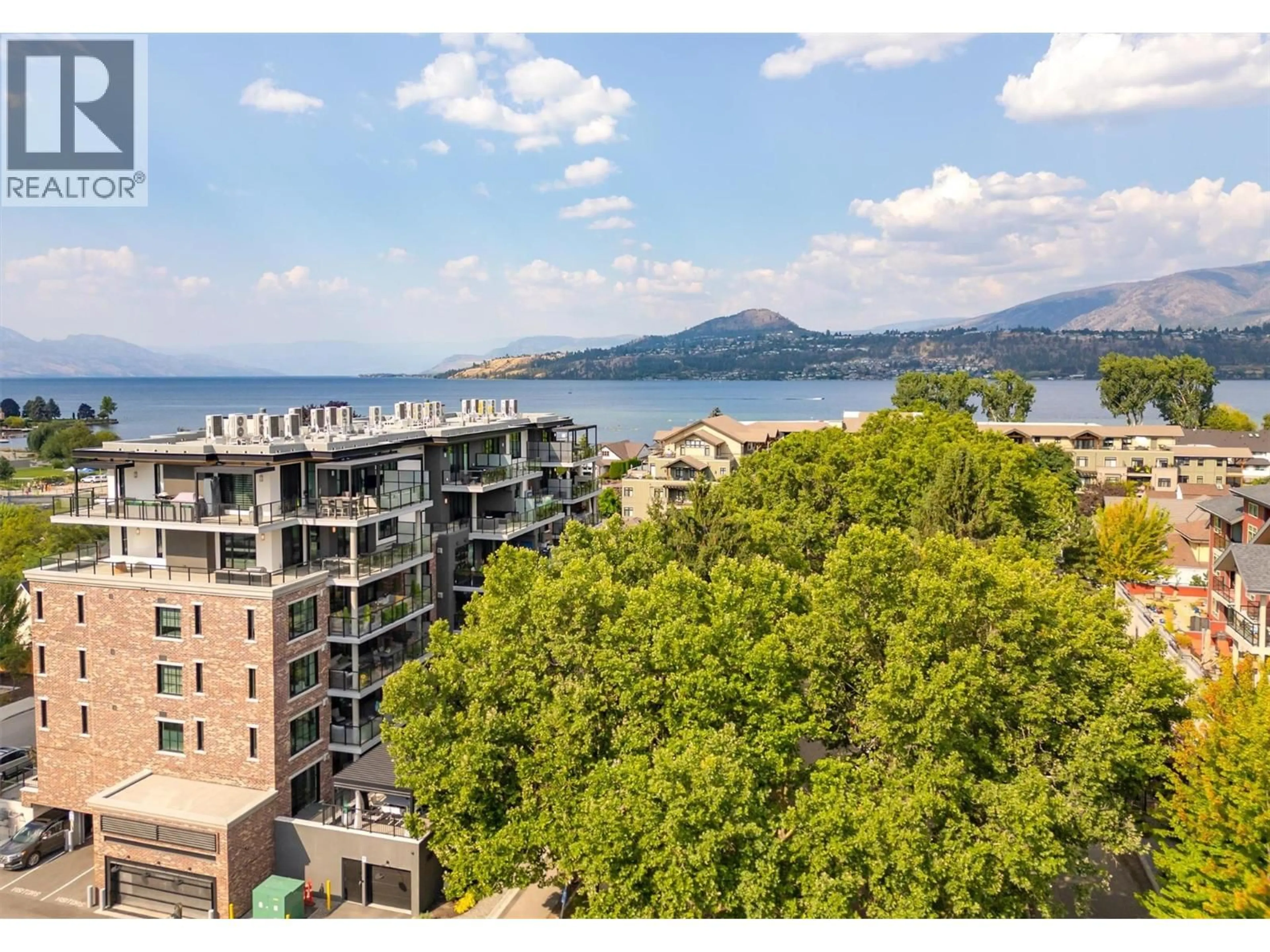 A pic from outside/outdoor area/front of a property/back of a property/a pic from drone, water/lake/river/ocean view for 102 - 450 GROVES AVENUE, Kelowna British Columbia V1Y4Y5