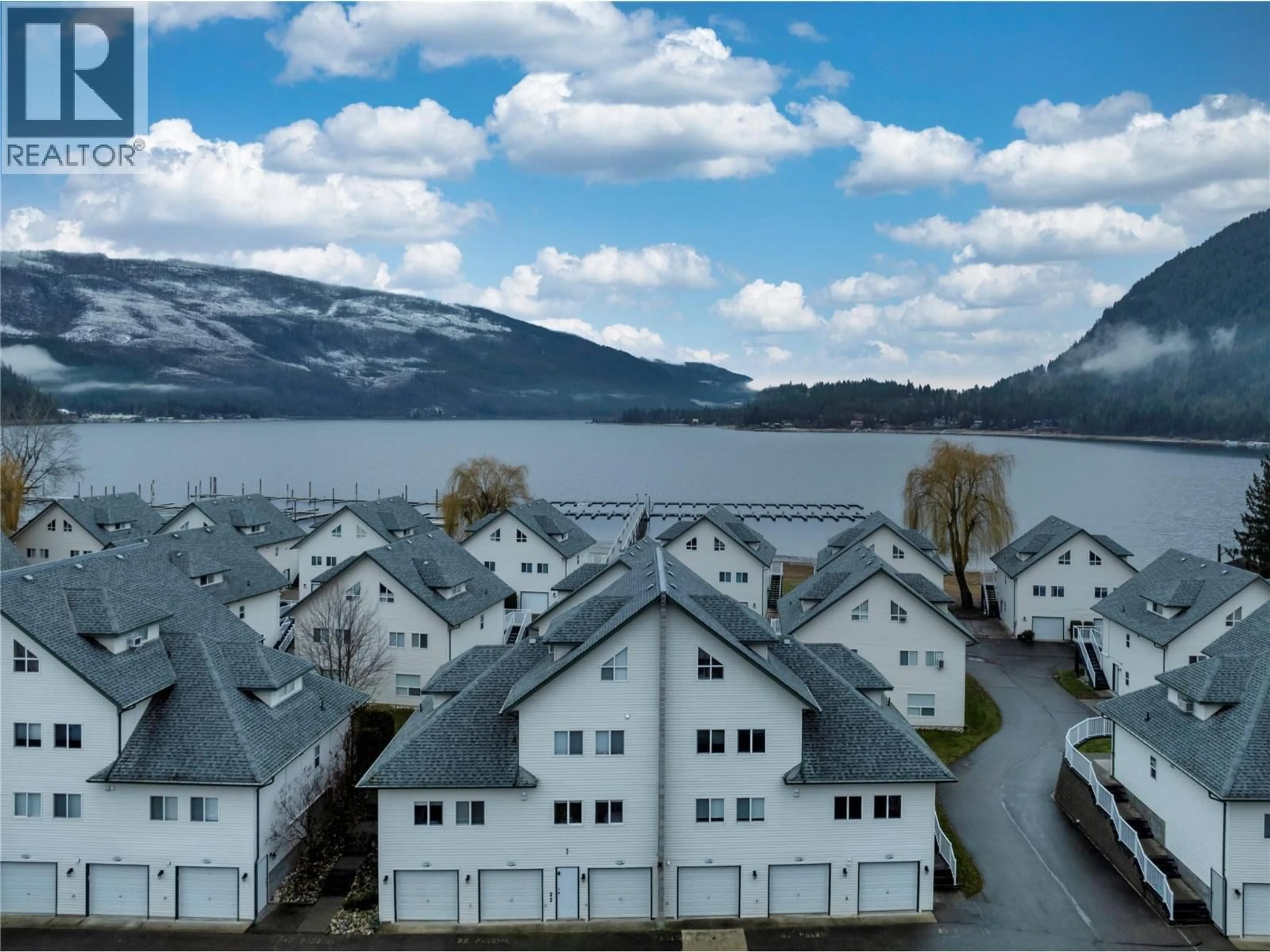 A pic from outside/outdoor area/front of a property/back of a property/a pic from drone, water/lake/river/ocean view for 237 - 213 WHITE PINE CRESCENT, Sicamous British Columbia V0E2V1