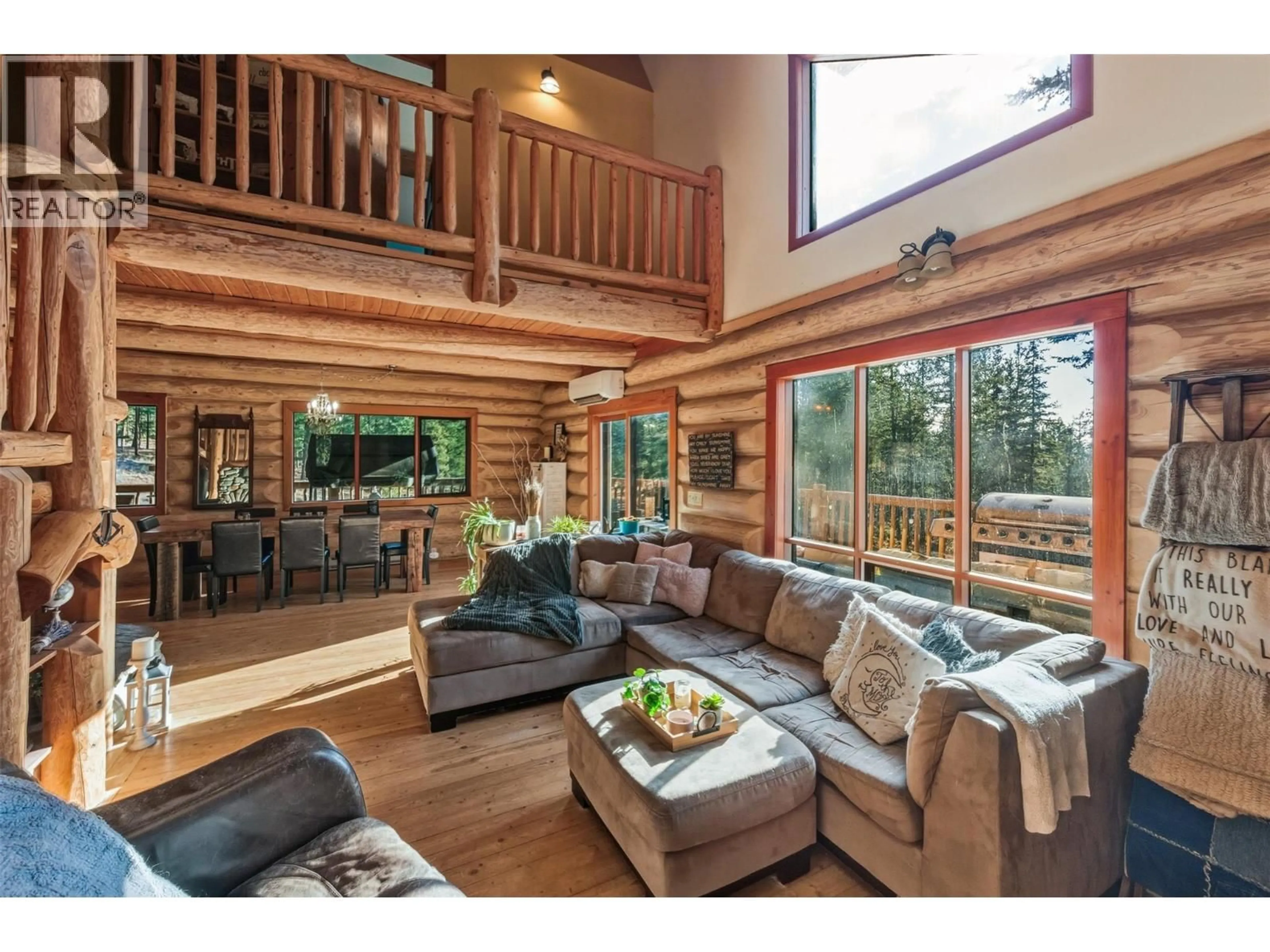 Living room with furniture, wood/laminate floor for 15 - 7080 GLENFIR ROAD, Naramata British Columbia V0H1N1