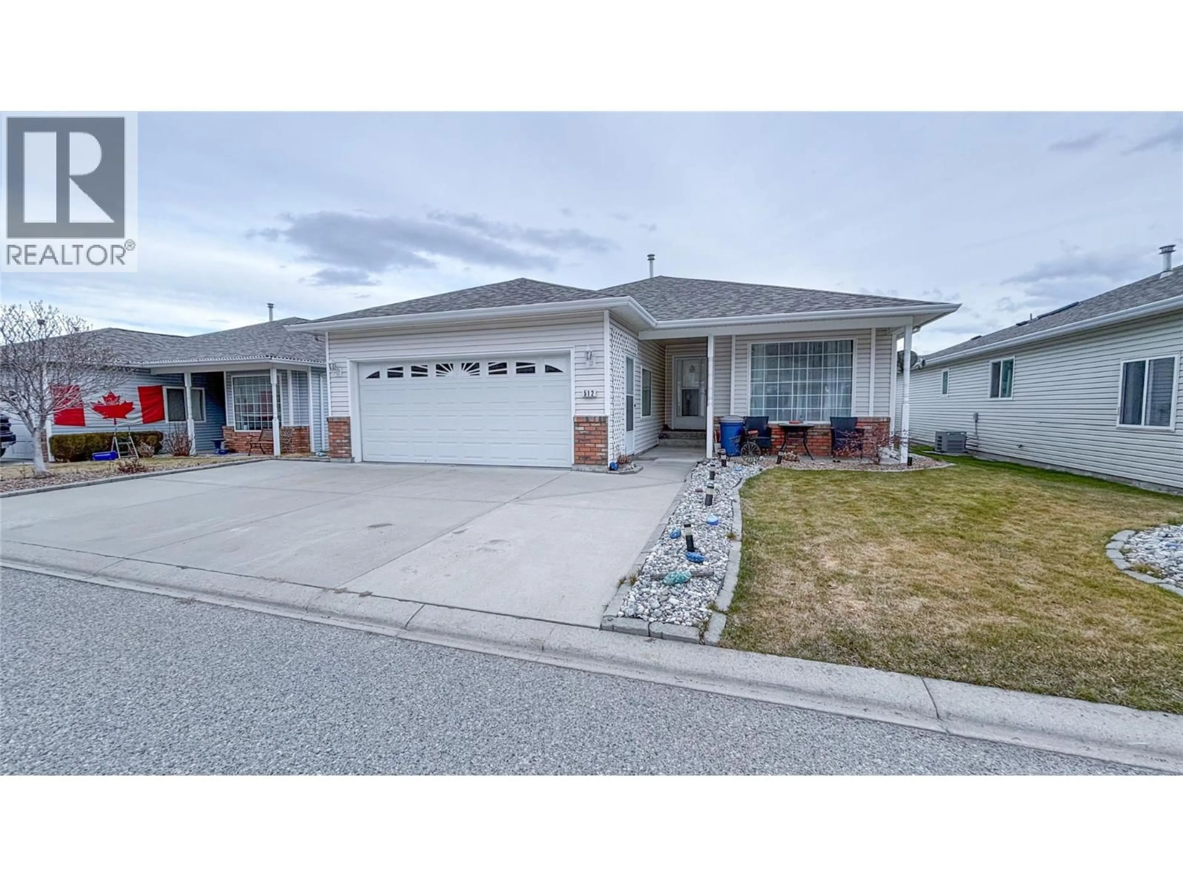 Home with vinyl exterior material, street for 512 RED WING DRIVE, Penticton British Columbia V2A8K6