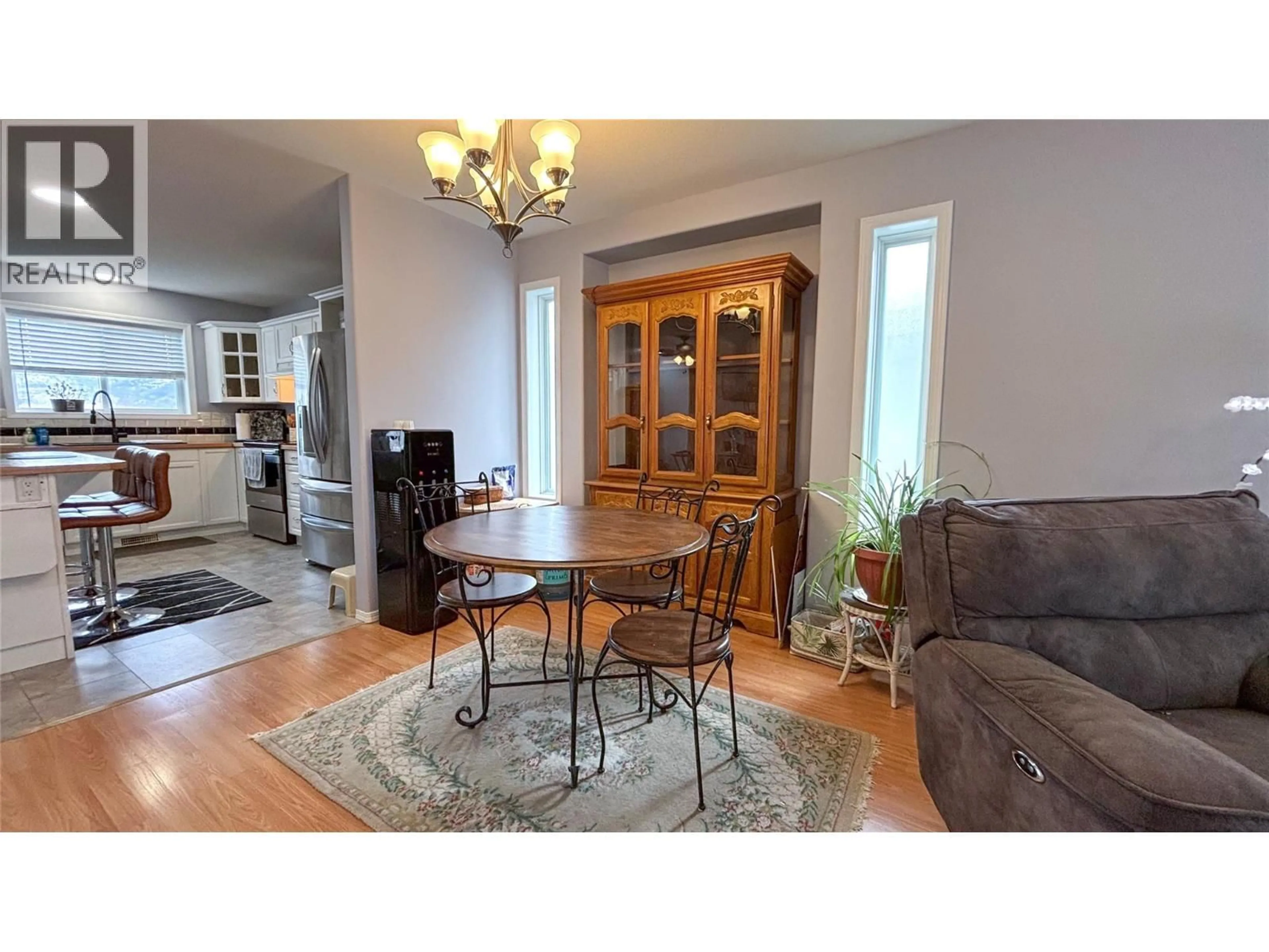 Living room with furniture, wood/laminate floor for 512 RED WING DRIVE, Penticton British Columbia V2A8K6