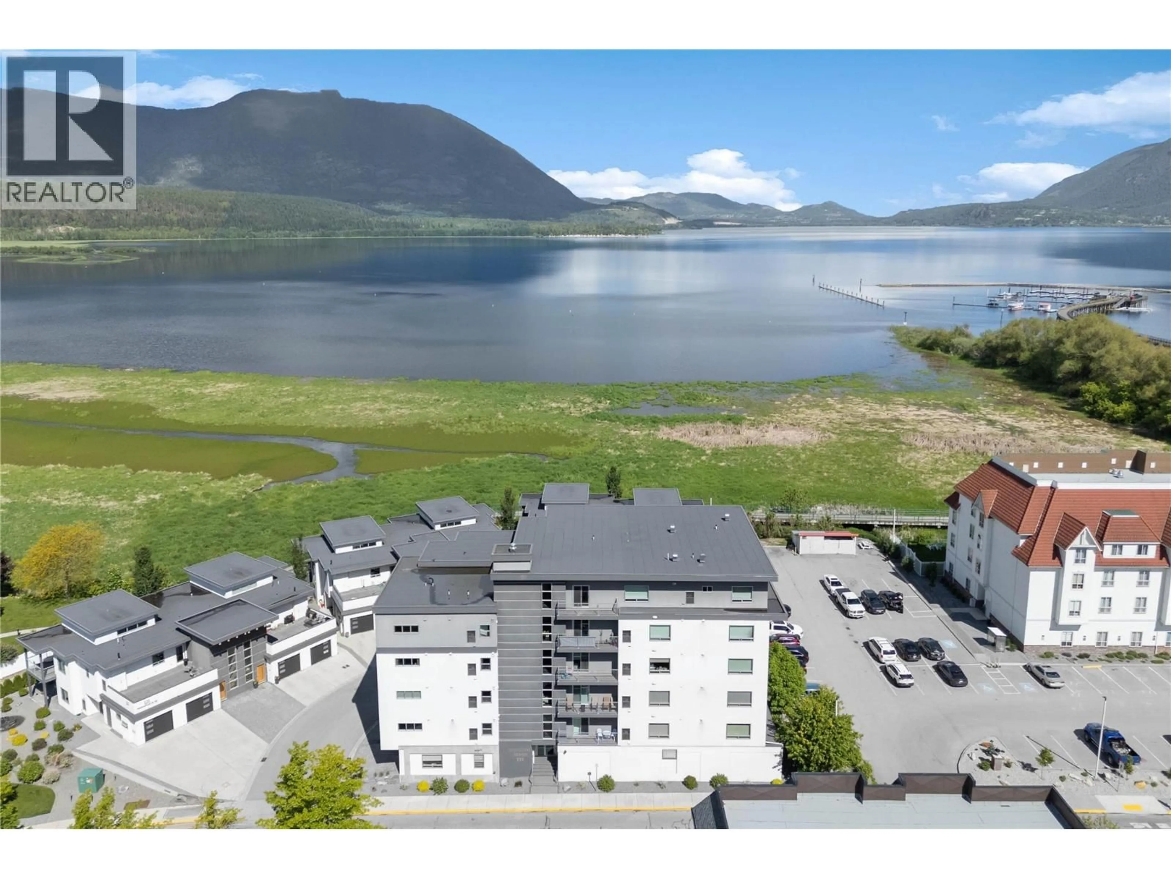 A pic from outside/outdoor area/front of a property/back of a property/a pic from drone, water/lake/river/ocean view for 501 - 131 HARBOURFRONT DRIVE NORTHEAST, Salmon Arm British Columbia V1E0G4