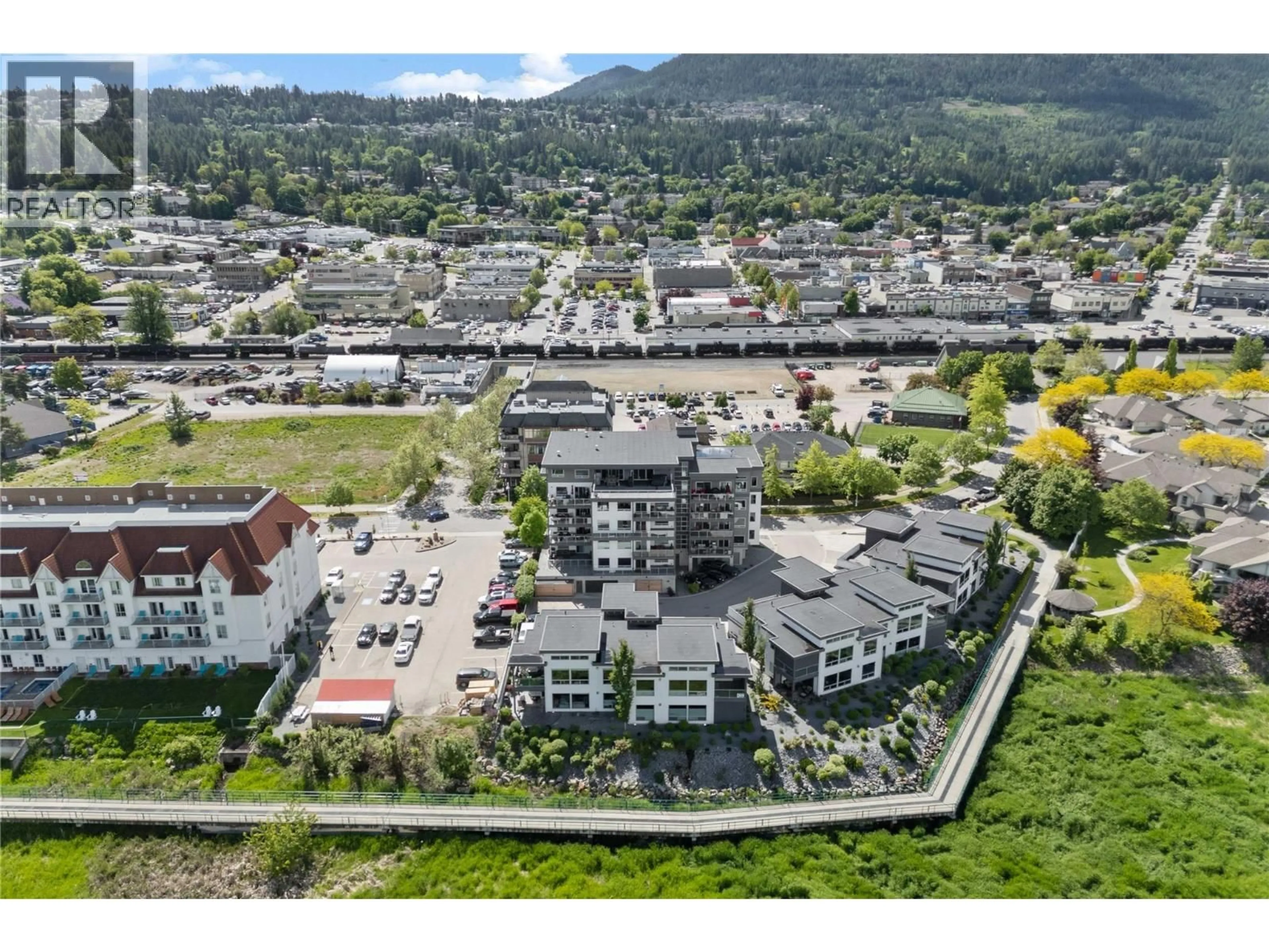A pic from outside/outdoor area/front of a property/back of a property/a pic from drone, mountain view for 501 - 131 HARBOURFRONT DRIVE NORTHEAST, Salmon Arm British Columbia V1E0G4
