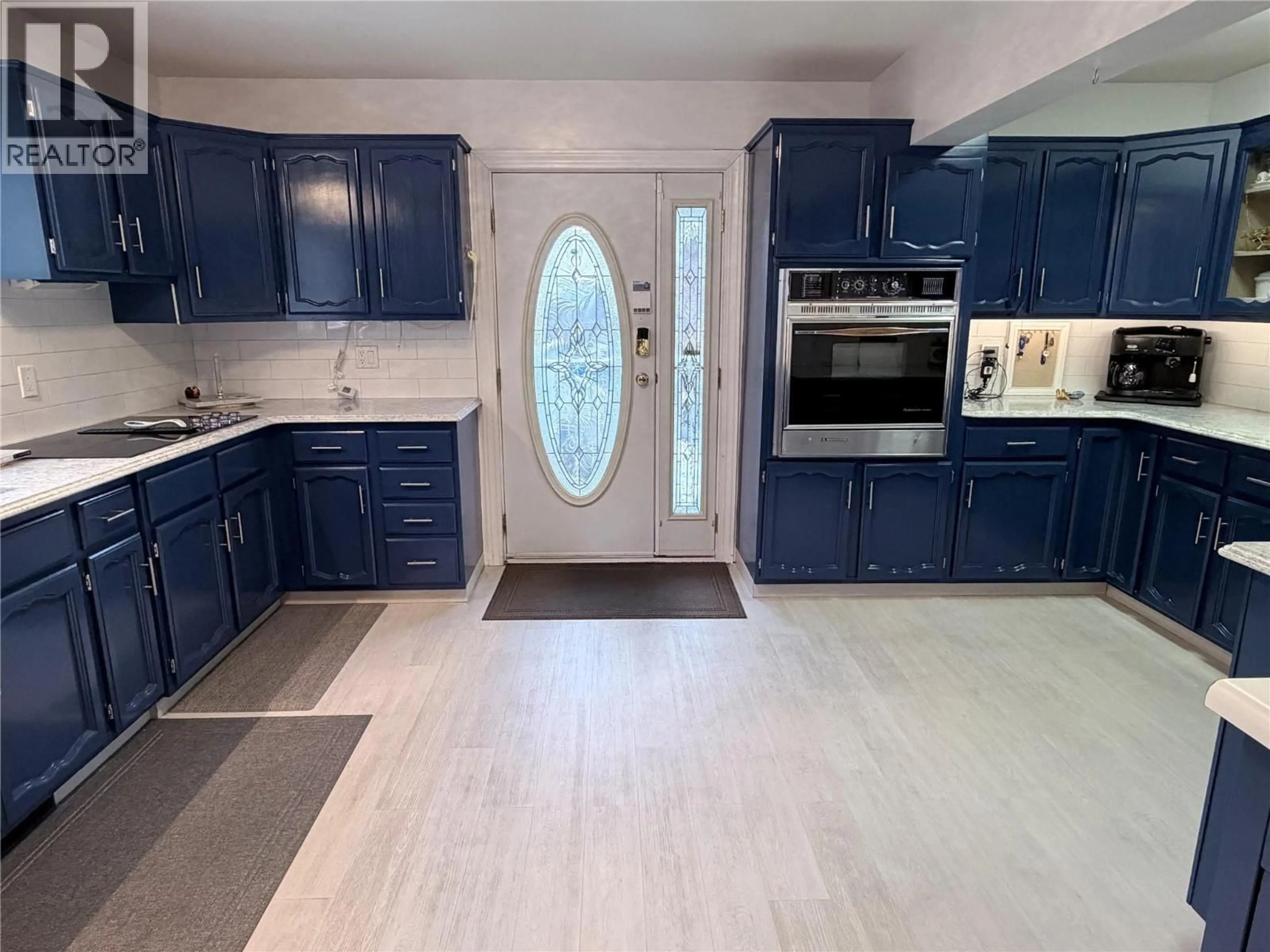 Open concept kitchen, ceramic/tile floor for 801 HOUSTON STREET, Nelson British Columbia V1L5J3