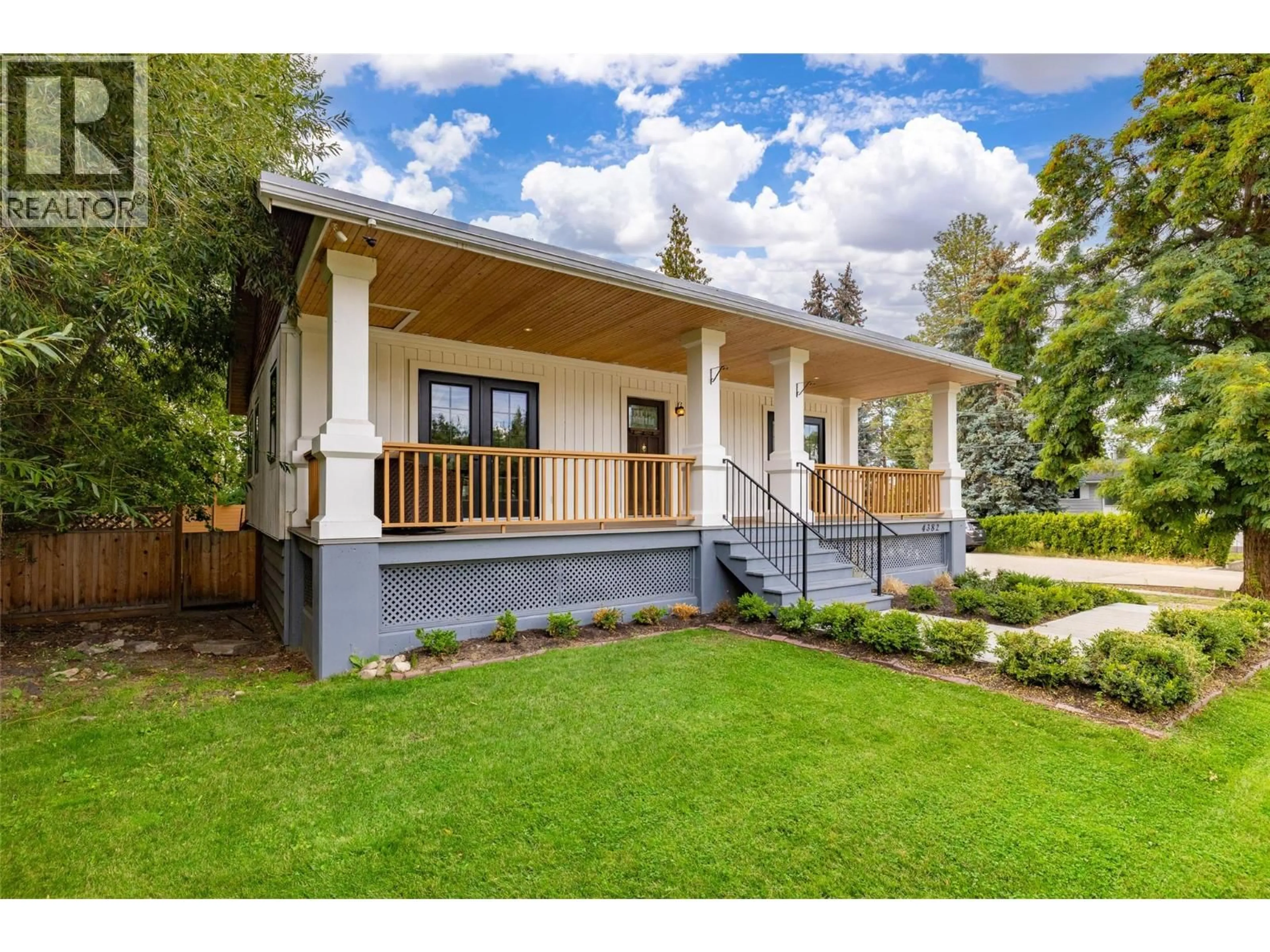 Home with vinyl exterior material, street for 4382 GORDON DRIVE, Kelowna British Columbia V1W1S8