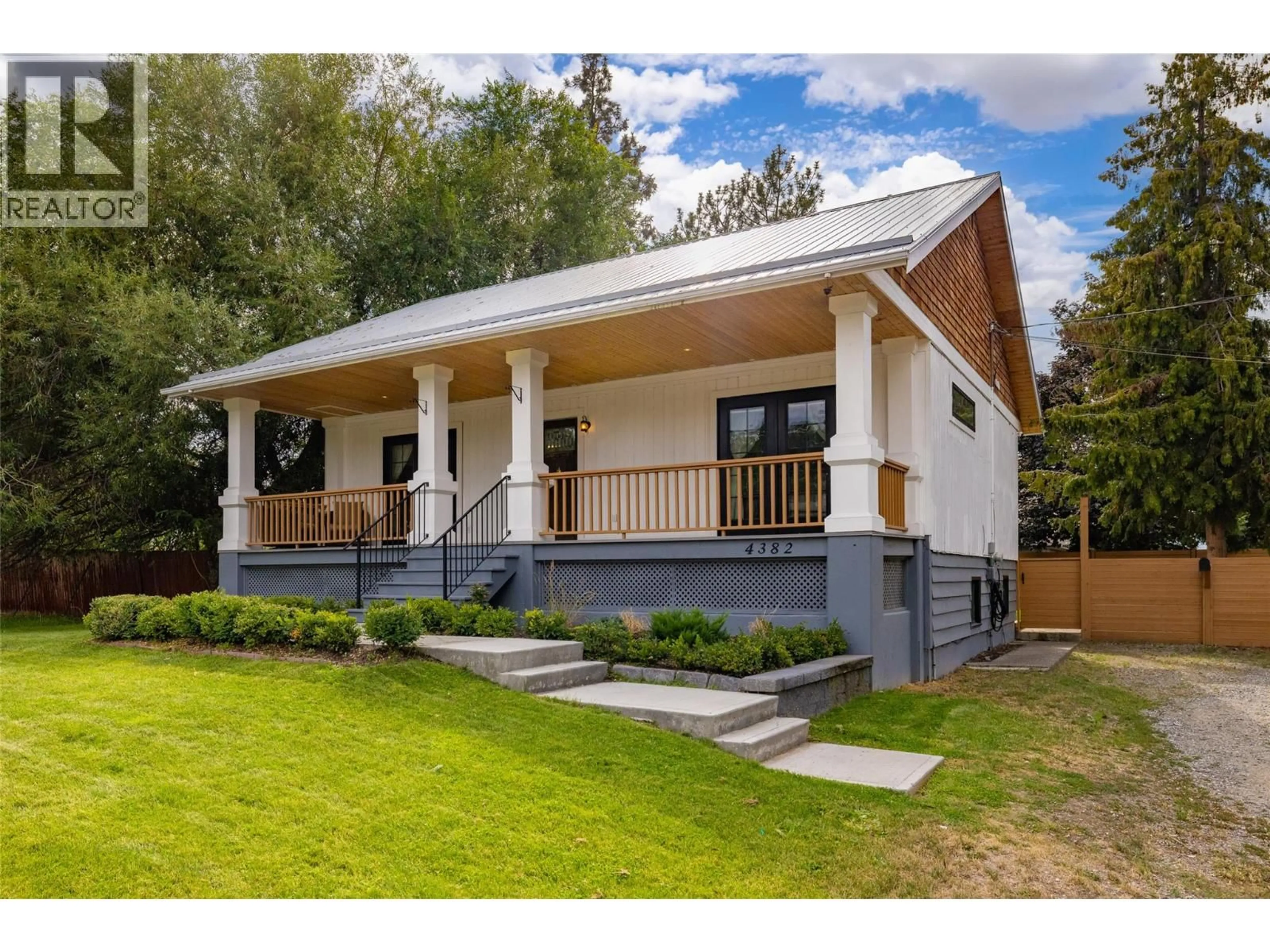 Home with vinyl exterior material, street for 4382 GORDON DRIVE, Kelowna British Columbia V1W1S8