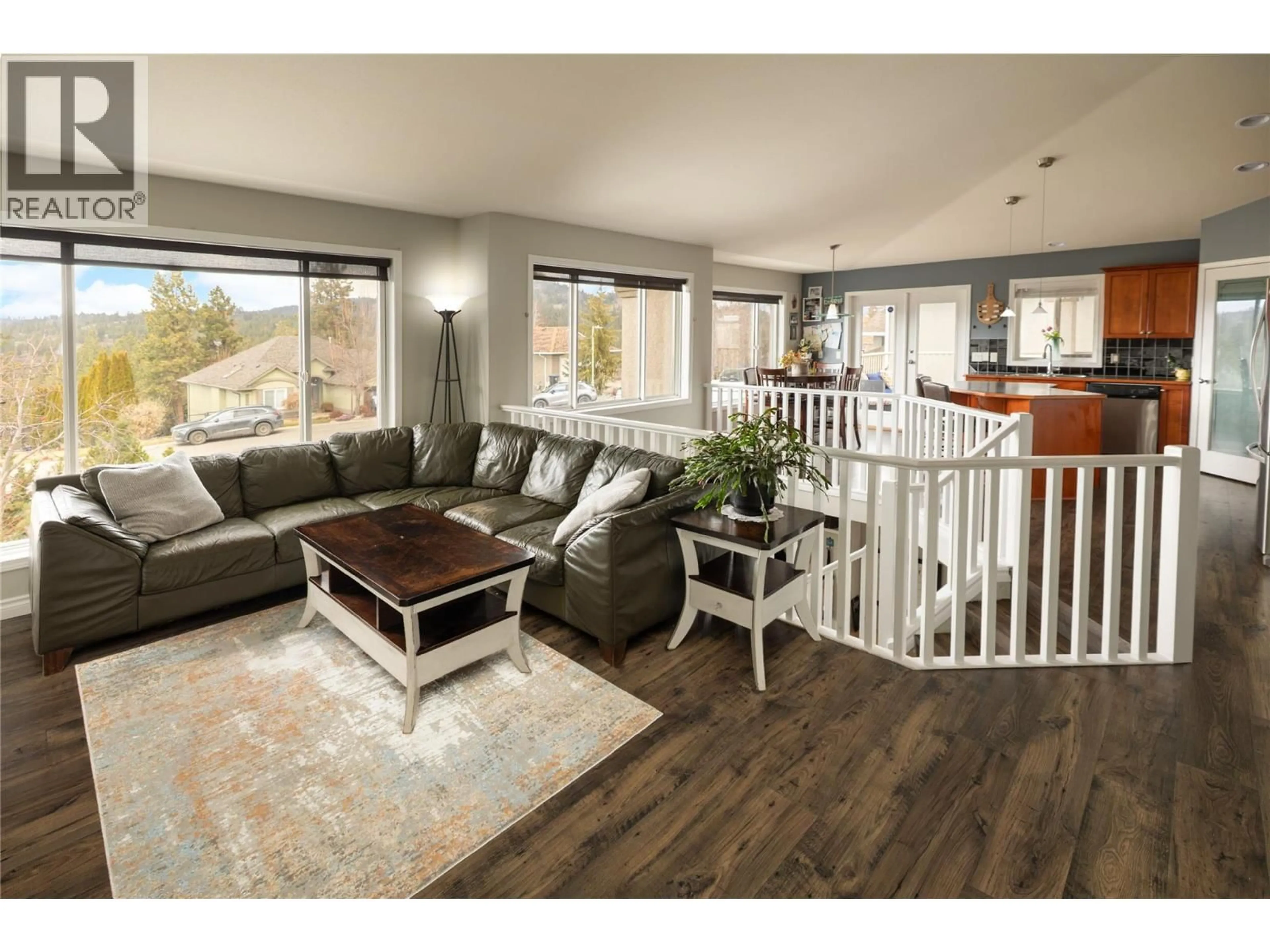 Living room with furniture, wood/laminate floor for 3013 BRINDISI PLACE, Kelowna British Columbia V1V2N5