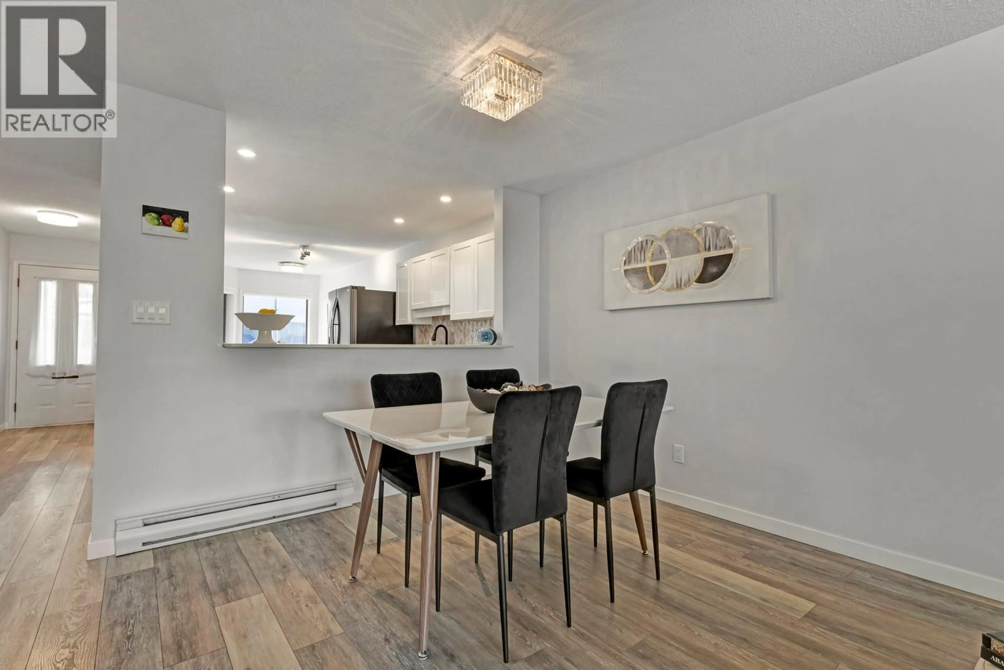 Dining room, wood/laminate floor for 115 - 1765 LECKIE ROAD, Kelowna British Columbia V1X6X5