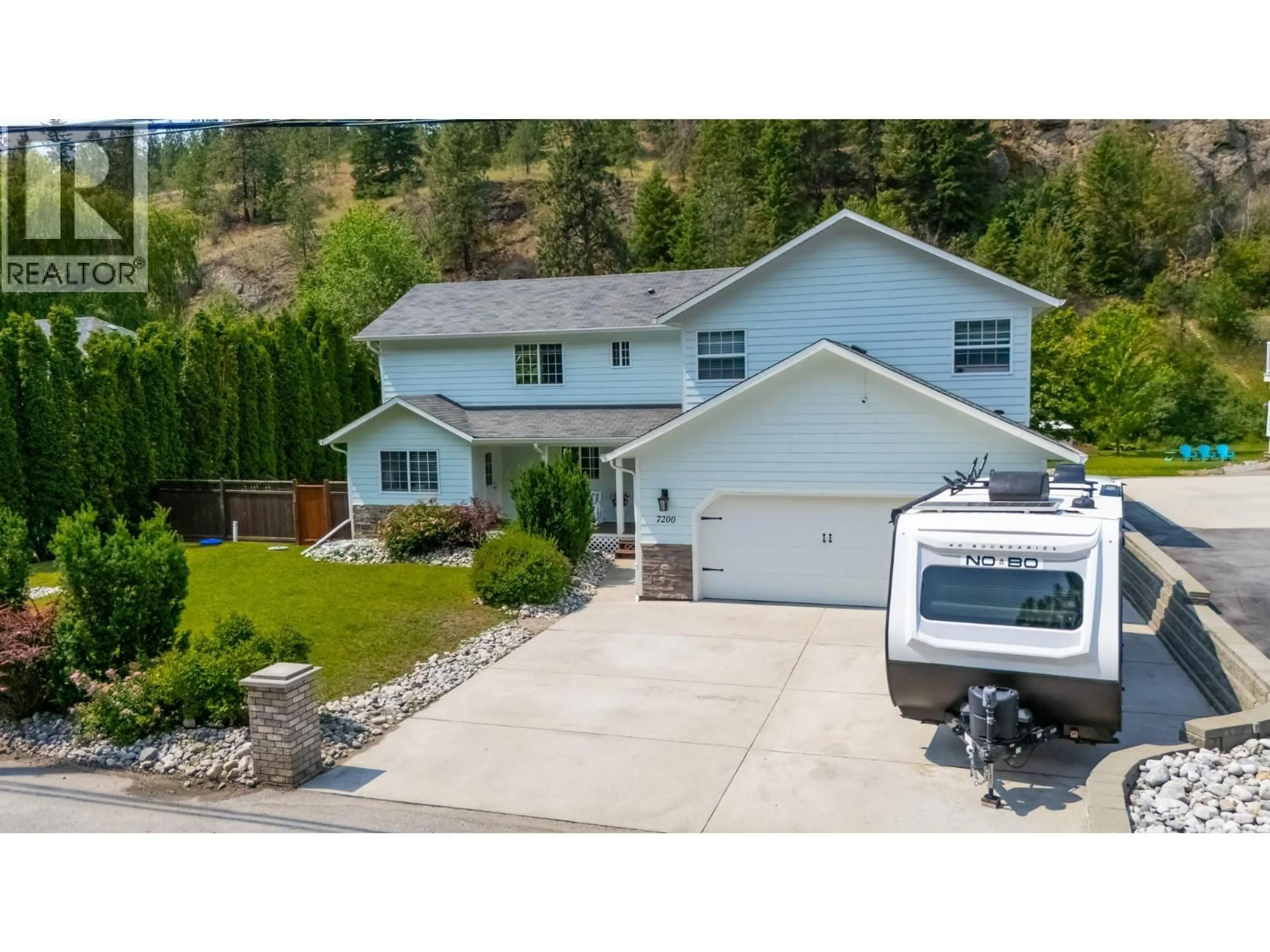 A pic from outside/outdoor area/front of a property/back of a property/a pic from drone, street for 7200 VICTORIA ROAD SOUTH, Summerland British Columbia V0H1Z2