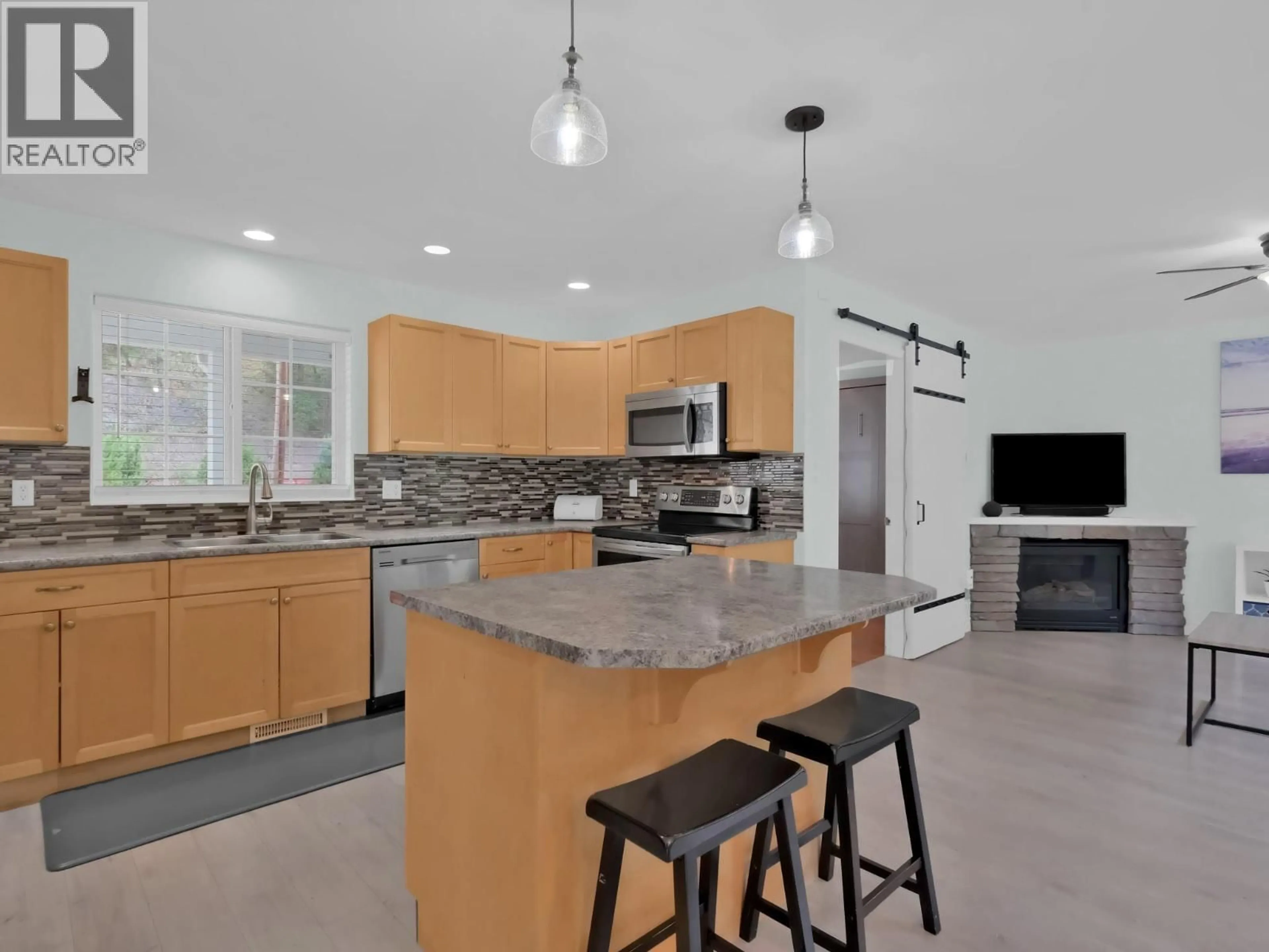 Open concept kitchen, ceramic/tile floor for 7200 VICTORIA ROAD SOUTH, Summerland British Columbia V0H1Z2
