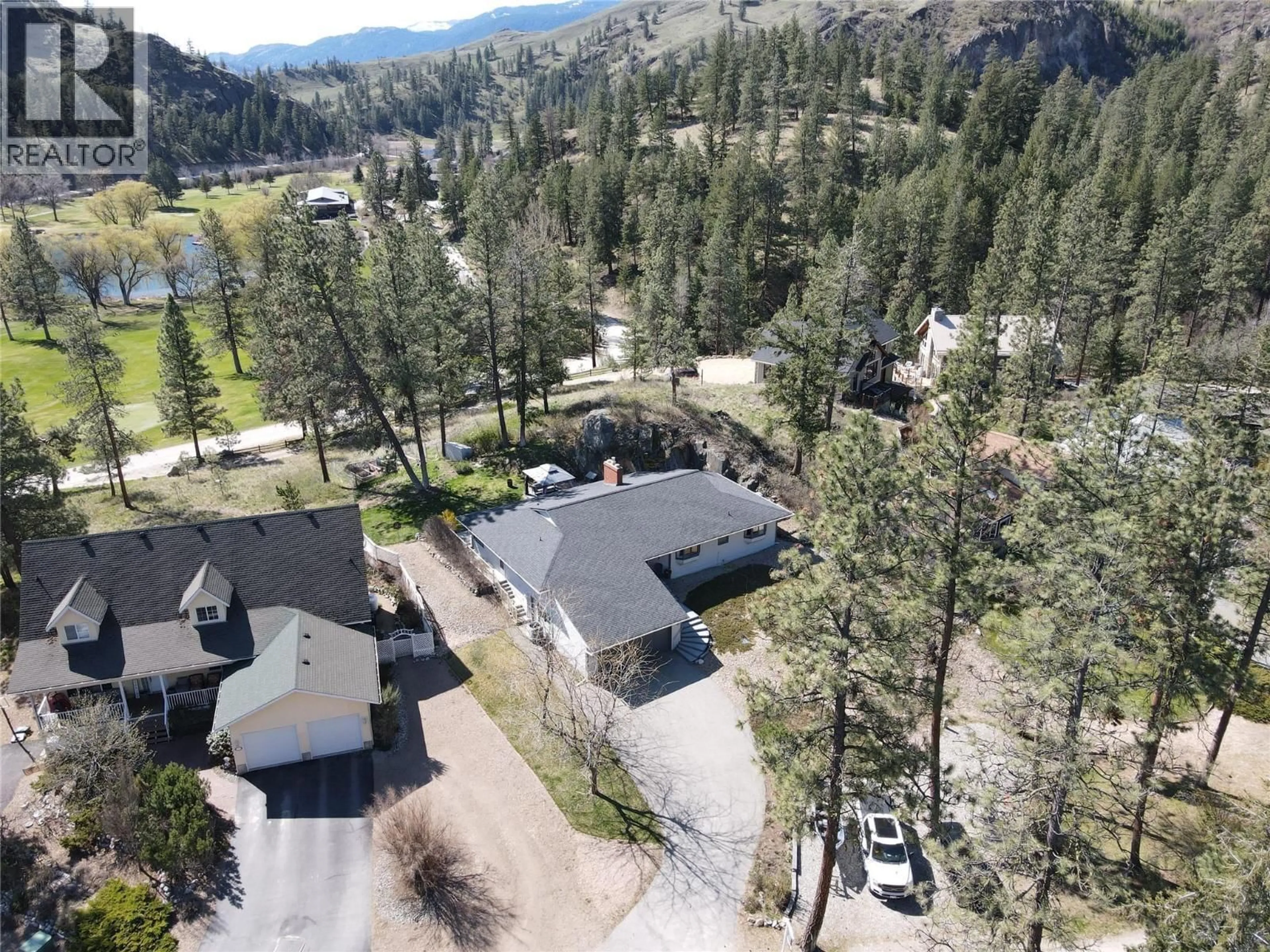 A pic from outside/outdoor area/front of a property/back of a property/a pic from drone, mountain view for 103 EAGLE DRIVE, Kaleden British Columbia V0H1K0