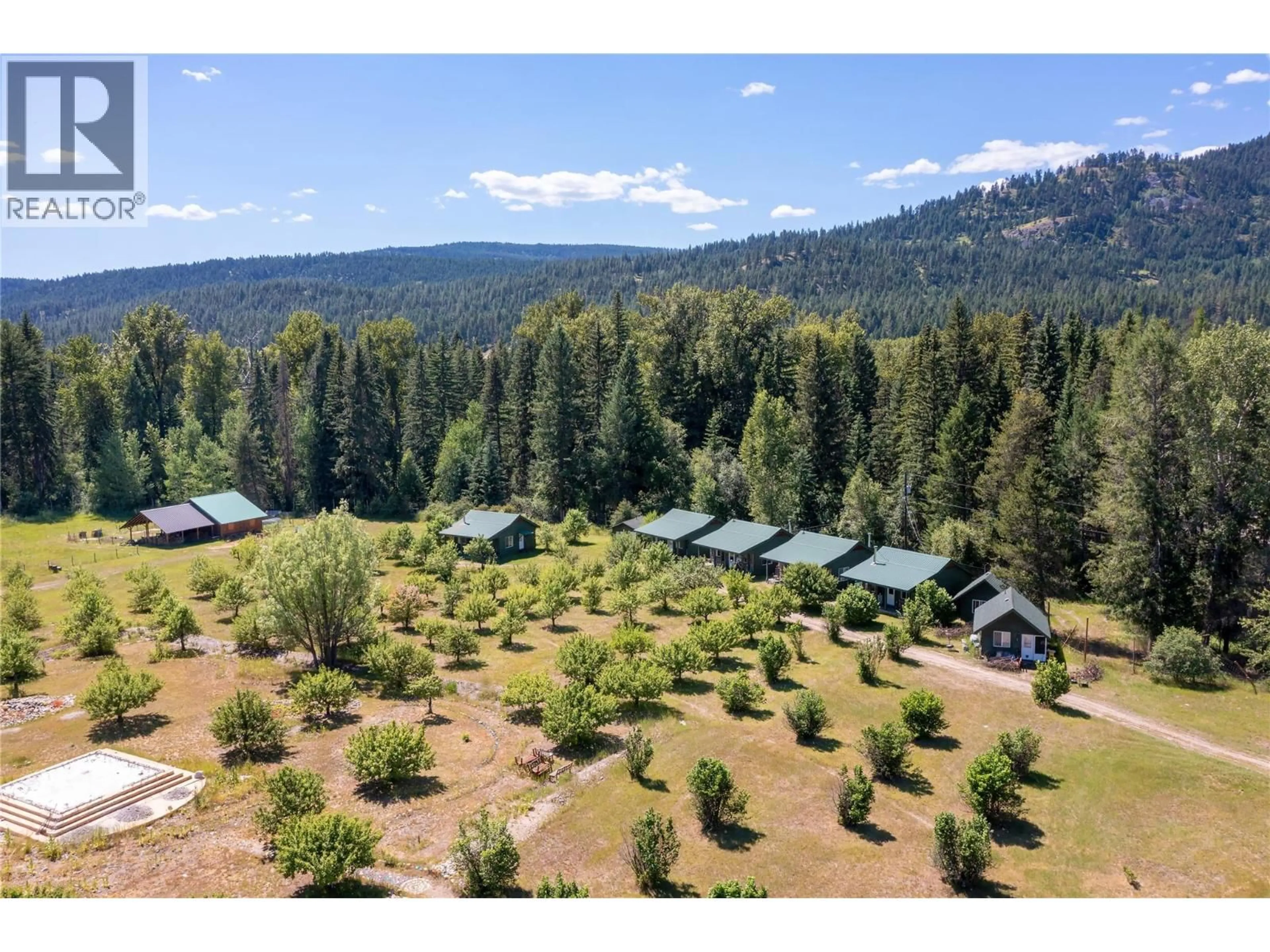 A pic from outside/outdoor area/front of a property/back of a property/a pic from drone, forest/trees view for 6055 KETTLE RIVER FORESTRY SERVICE ROAD, Westbridge British Columbia V0H1Y0