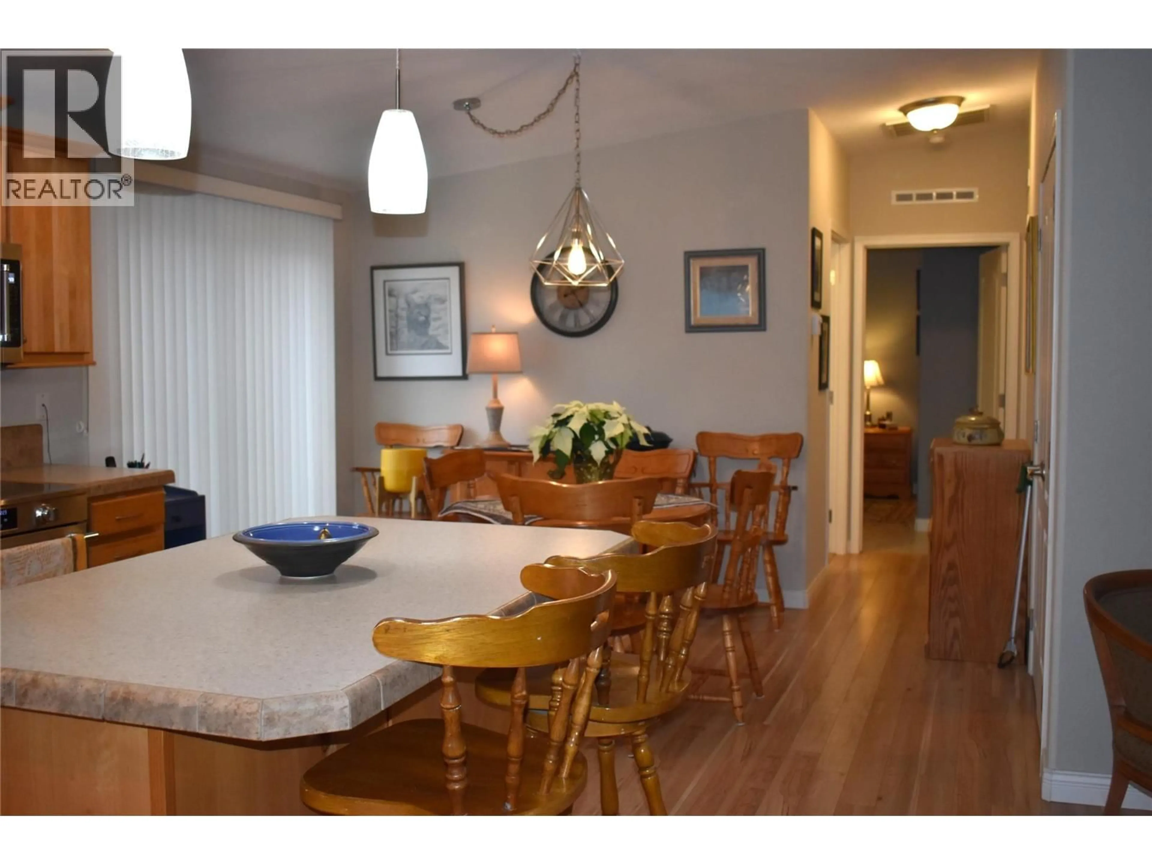 Dining room, wood/laminate floor for 41 - 8300 GALLAGHER LAKE FRONTAGE ROAD, Oliver British Columbia V0H1T2