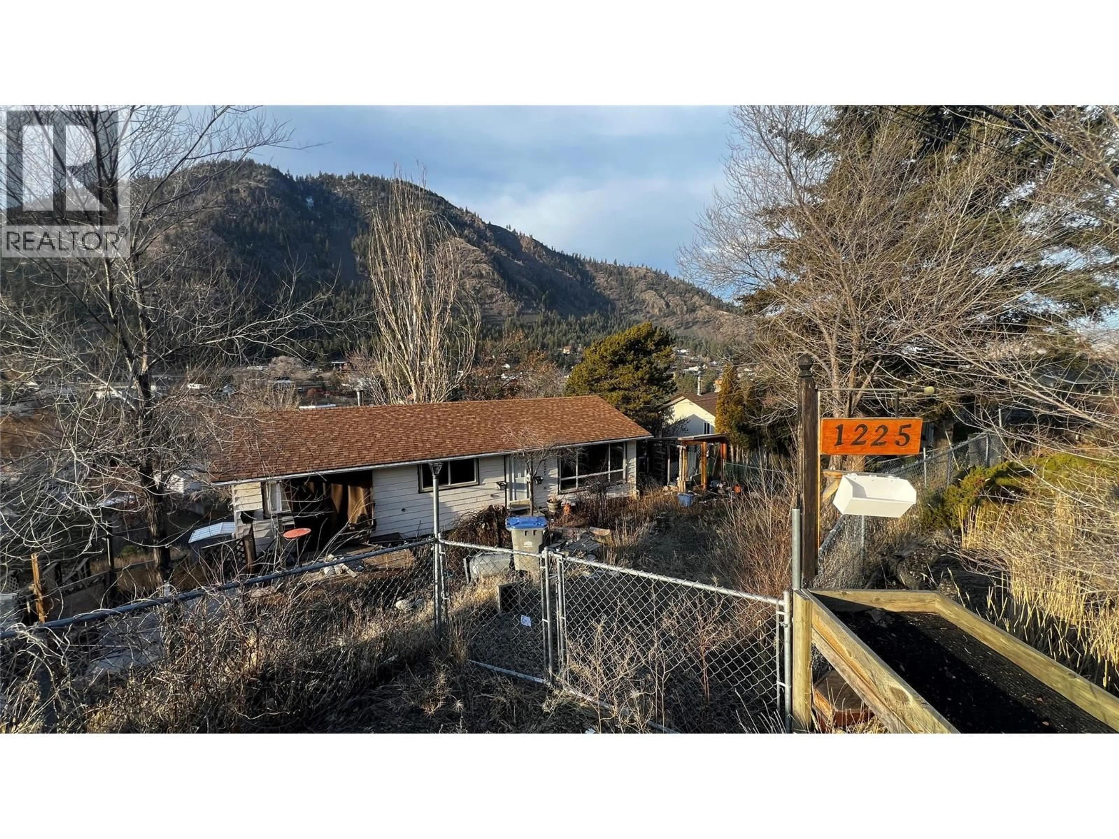 A pic from outside/outdoor area/front of a property/back of a property/a pic from drone, mountain view for 1225 HIGHRIDGE DRIVE, Kamloops British Columbia V2C5G5