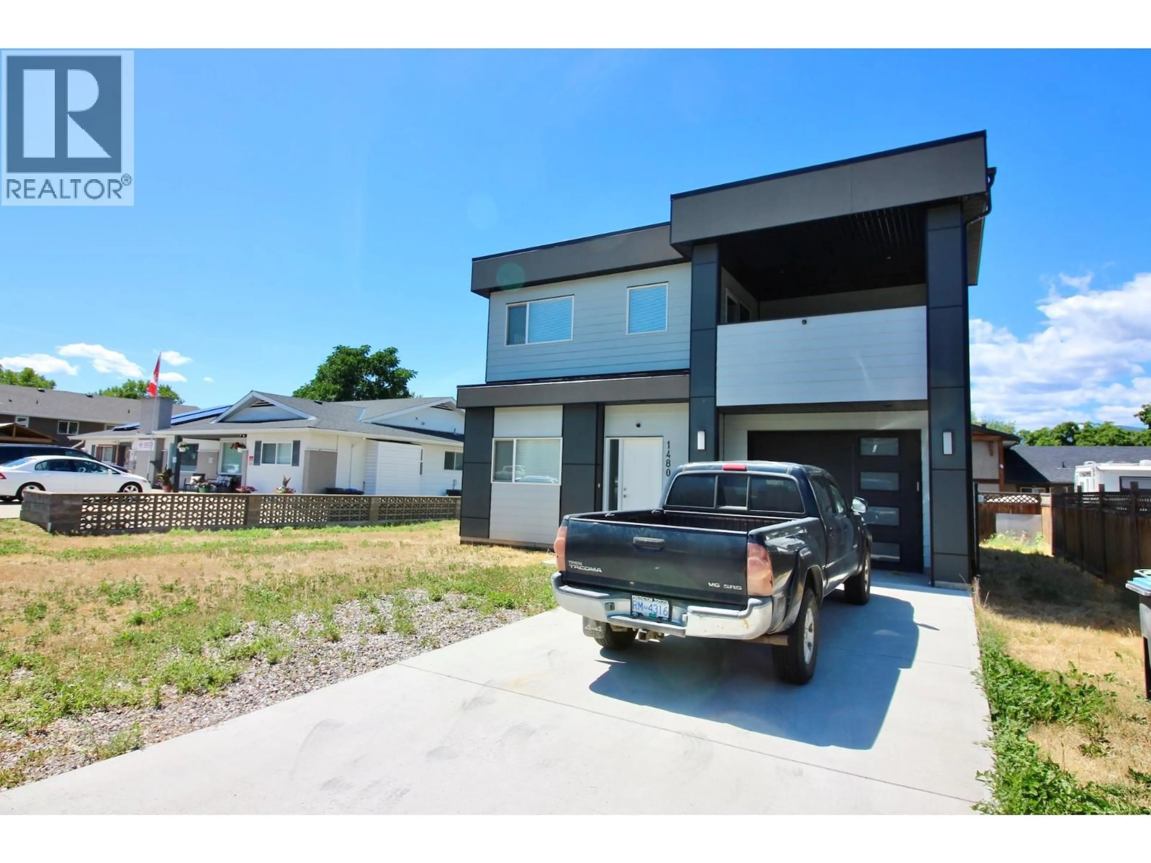 A pic from outside/outdoor area/front of a property/back of a property/a pic from drone, street for 1480 INKAR ROAD, Kelowna British Columbia V1Y8H7
