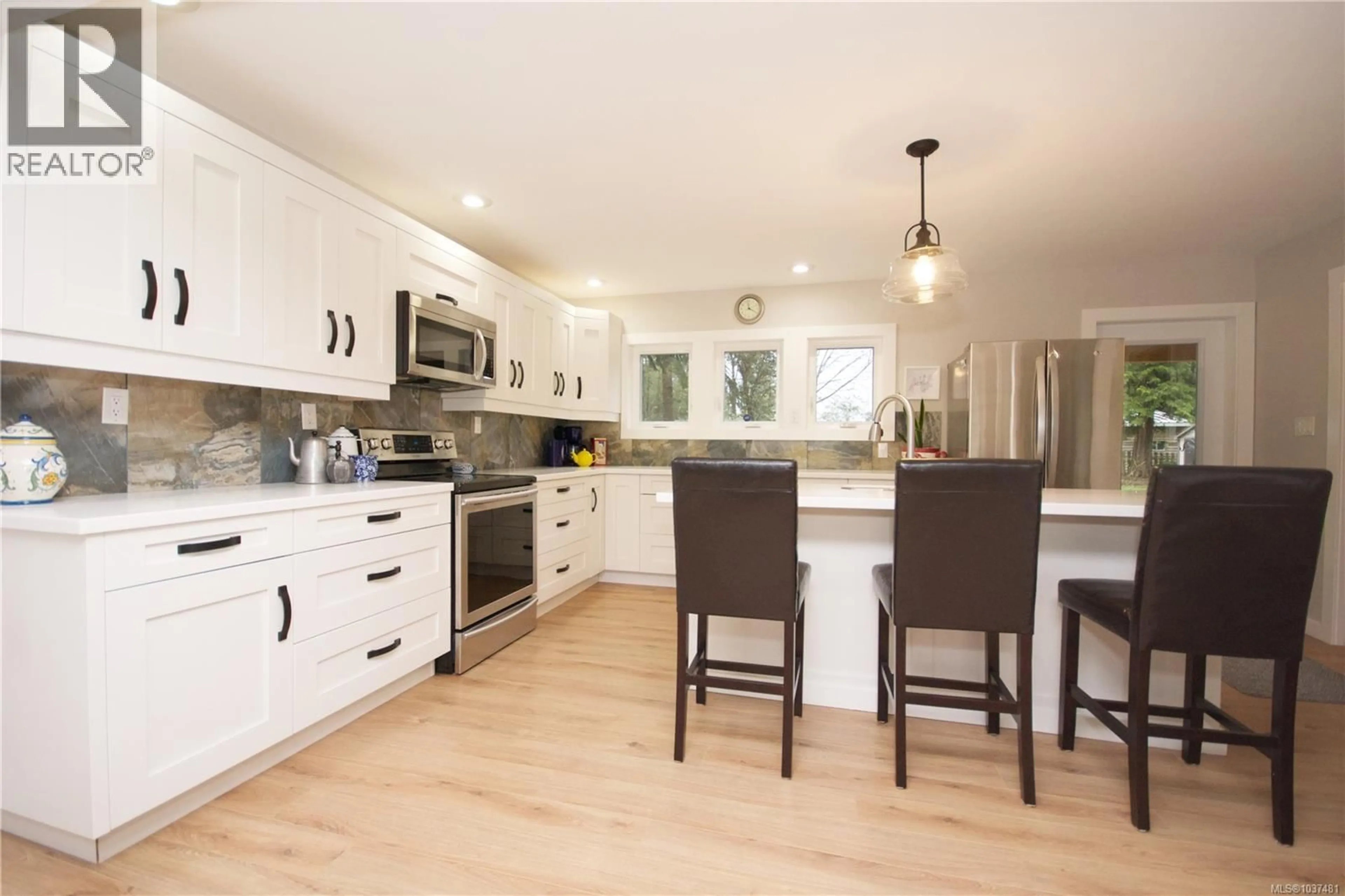 Open concept kitchen, wood/laminate floor for 1221 GANSKE ROAD, Qualicum Beach British Columbia V9K2G4