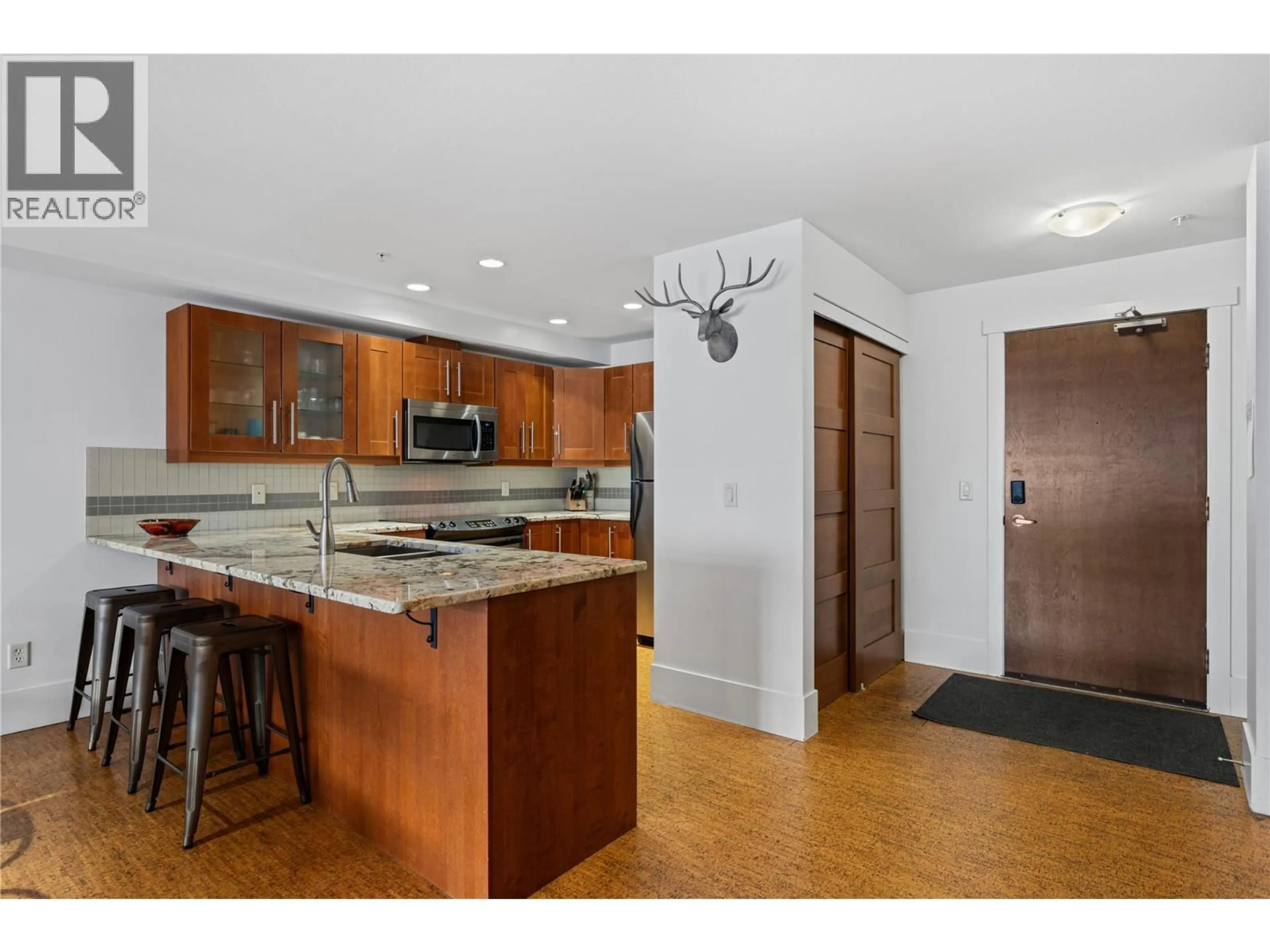 Open concept kitchen, ceramic/tile floor for 101 - 5030 SNOWBIRD WAY, Big White British Columbia V0H1A0