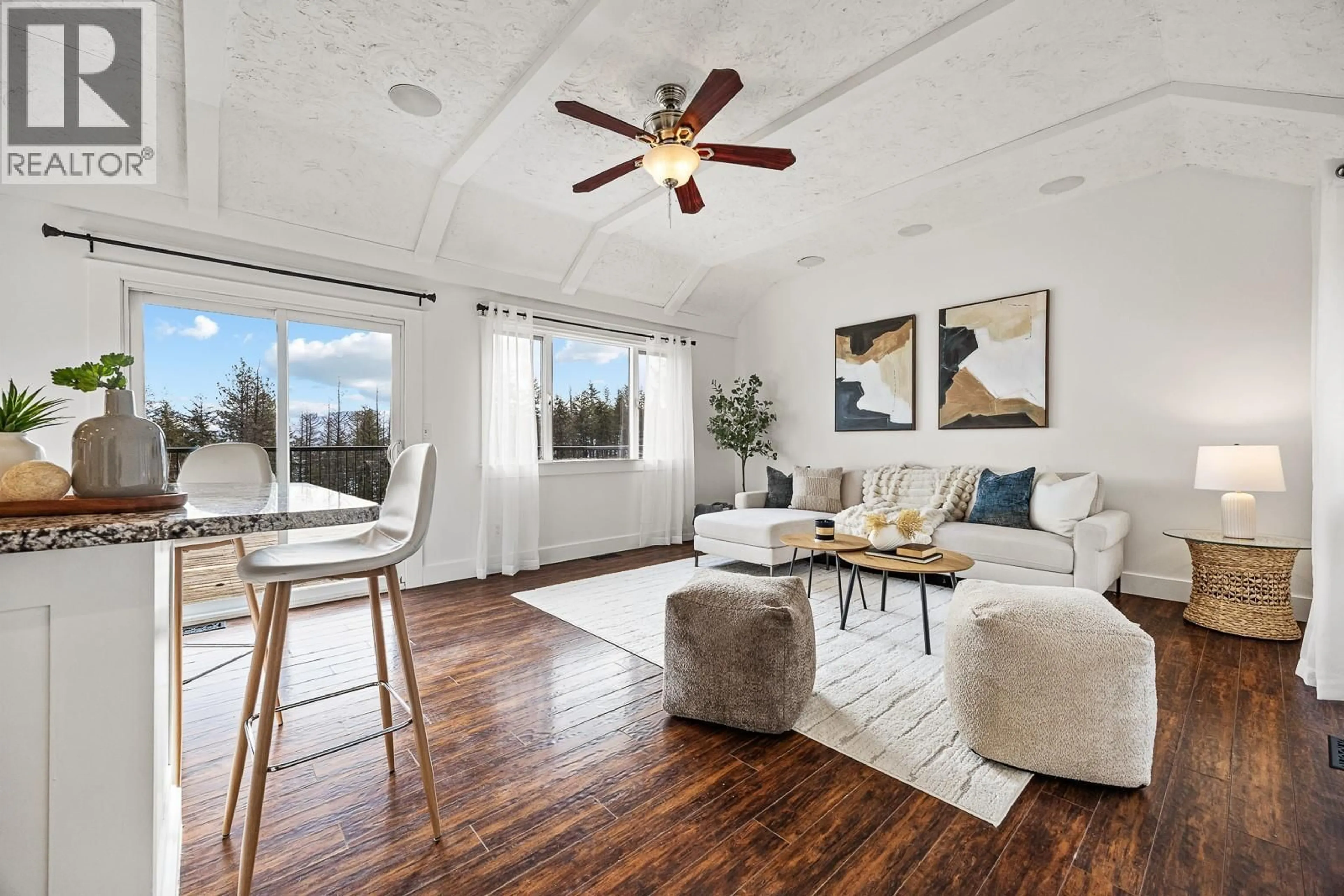 Living room with furniture, wood/laminate floor for 674 UDELL ROAD, Kelowna British Columbia V1H2E3
