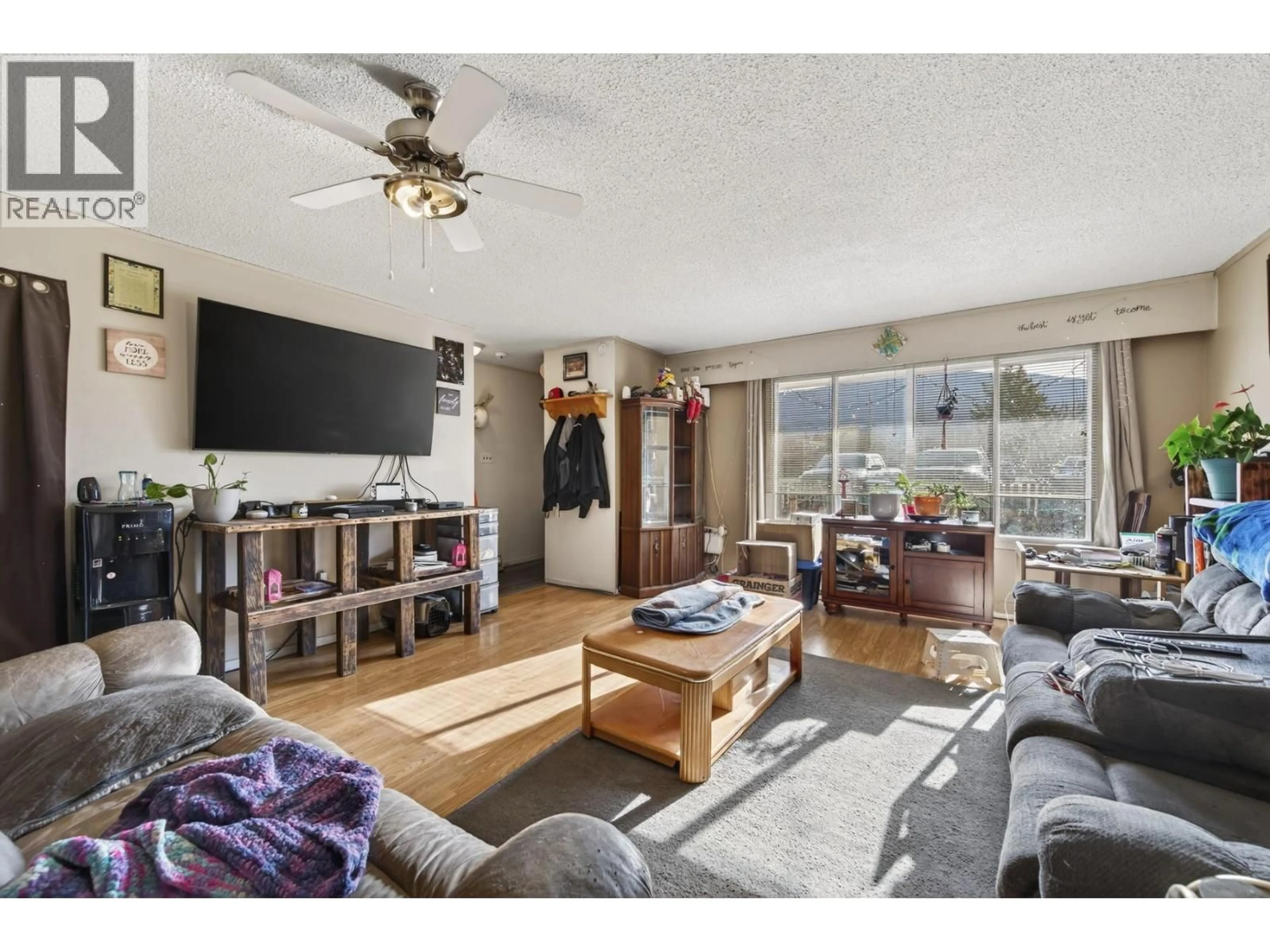 Living room with furniture, wood/laminate floor for 1895 MENZIES STREET, Merritt British Columbia V1K1E4