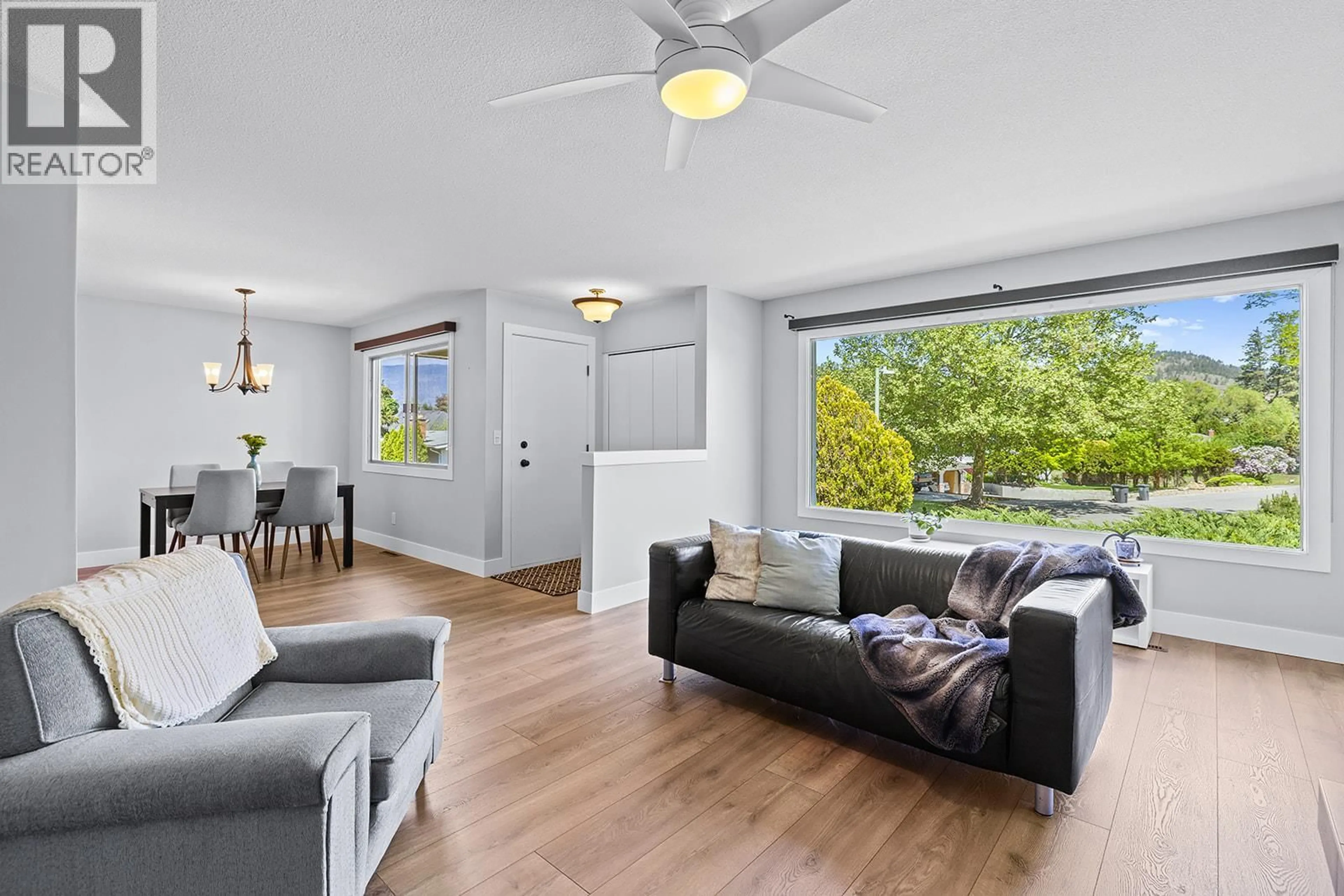 Living room with furniture, wood/laminate floor for 1745 HAUG AVENUE, Kelowna British Columbia V1Y4M3