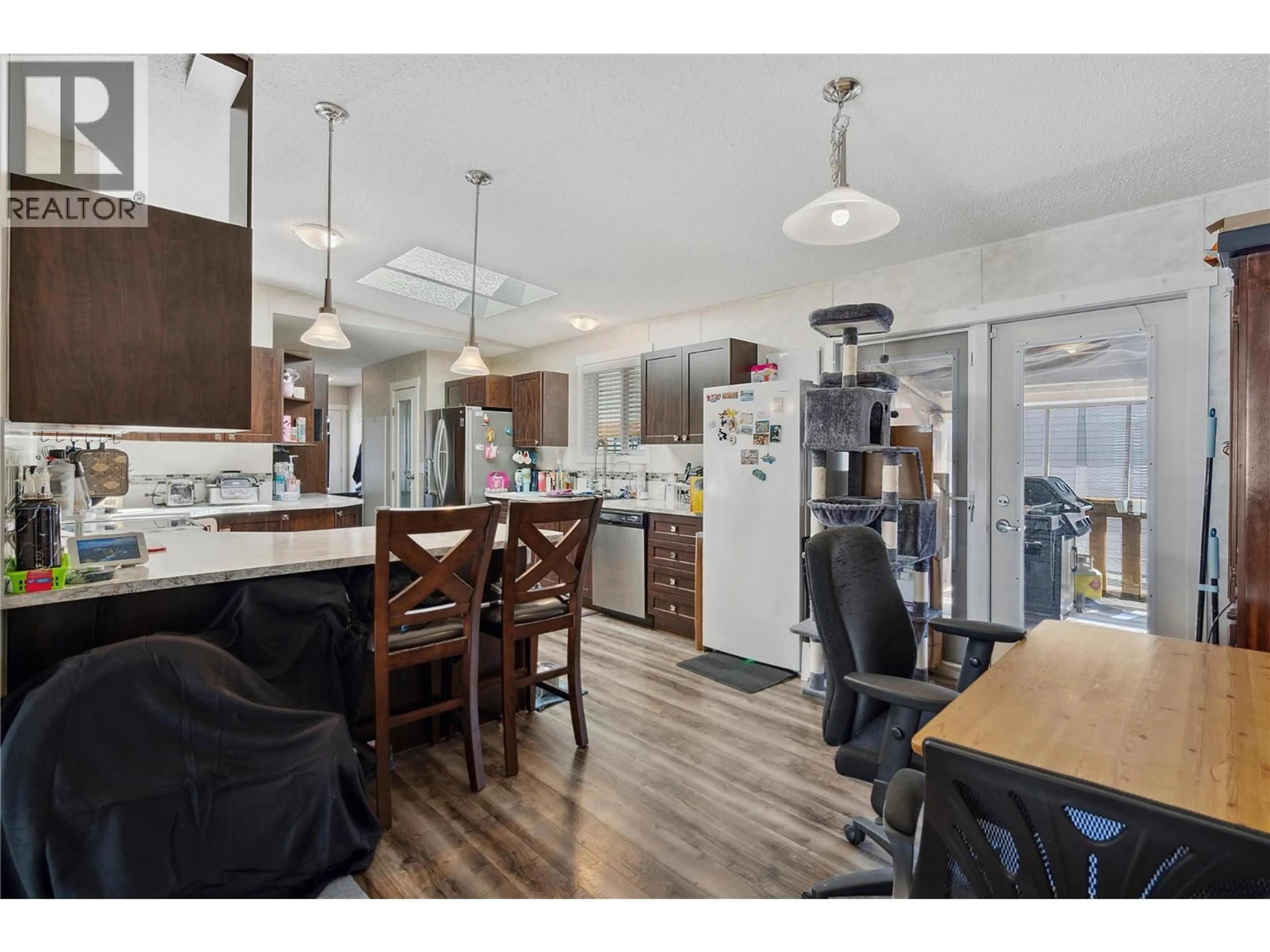 Open concept kitchen, wood/laminate floor for 175 - 9020 JIM BAILEY ROAD, Kelowna British Columbia V4V1E5