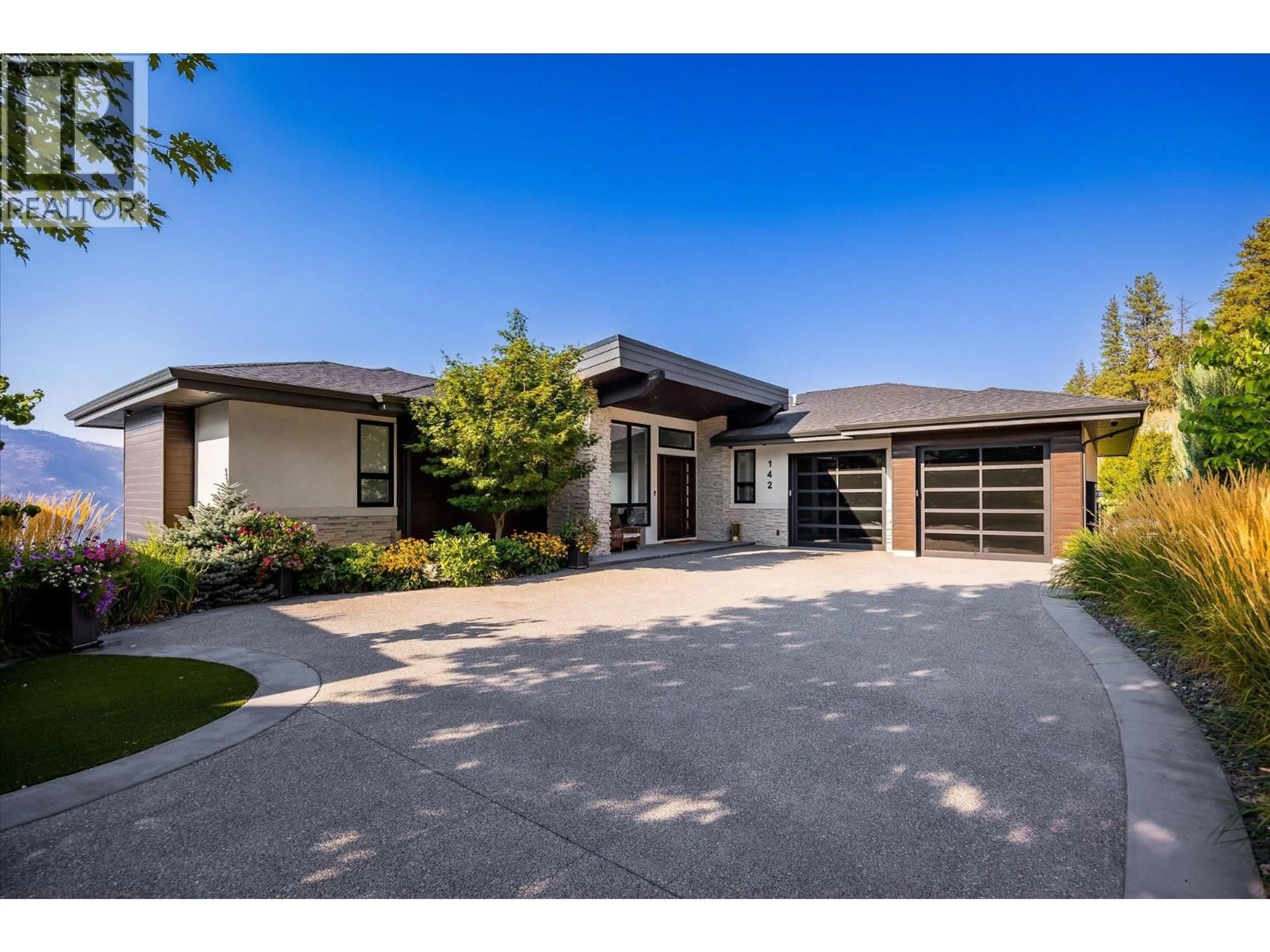Home with brick exterior material, street for 142 RED SKY COURT, Kelowna British Columbia V1V3G4