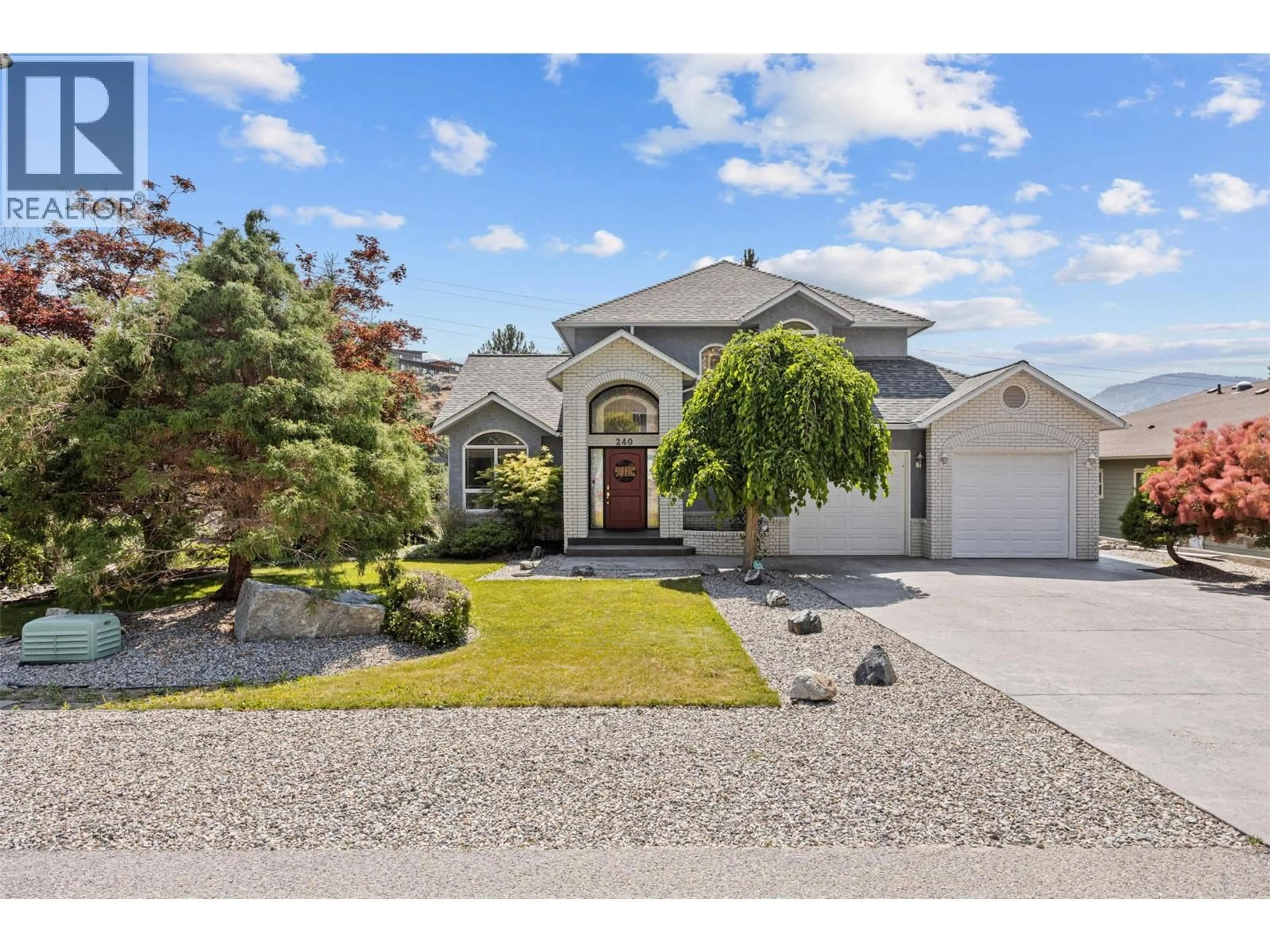 Home with vinyl exterior material, street for 240 HERITAGE BOULEVARD, Okanagan Falls British Columbia V0H1R3