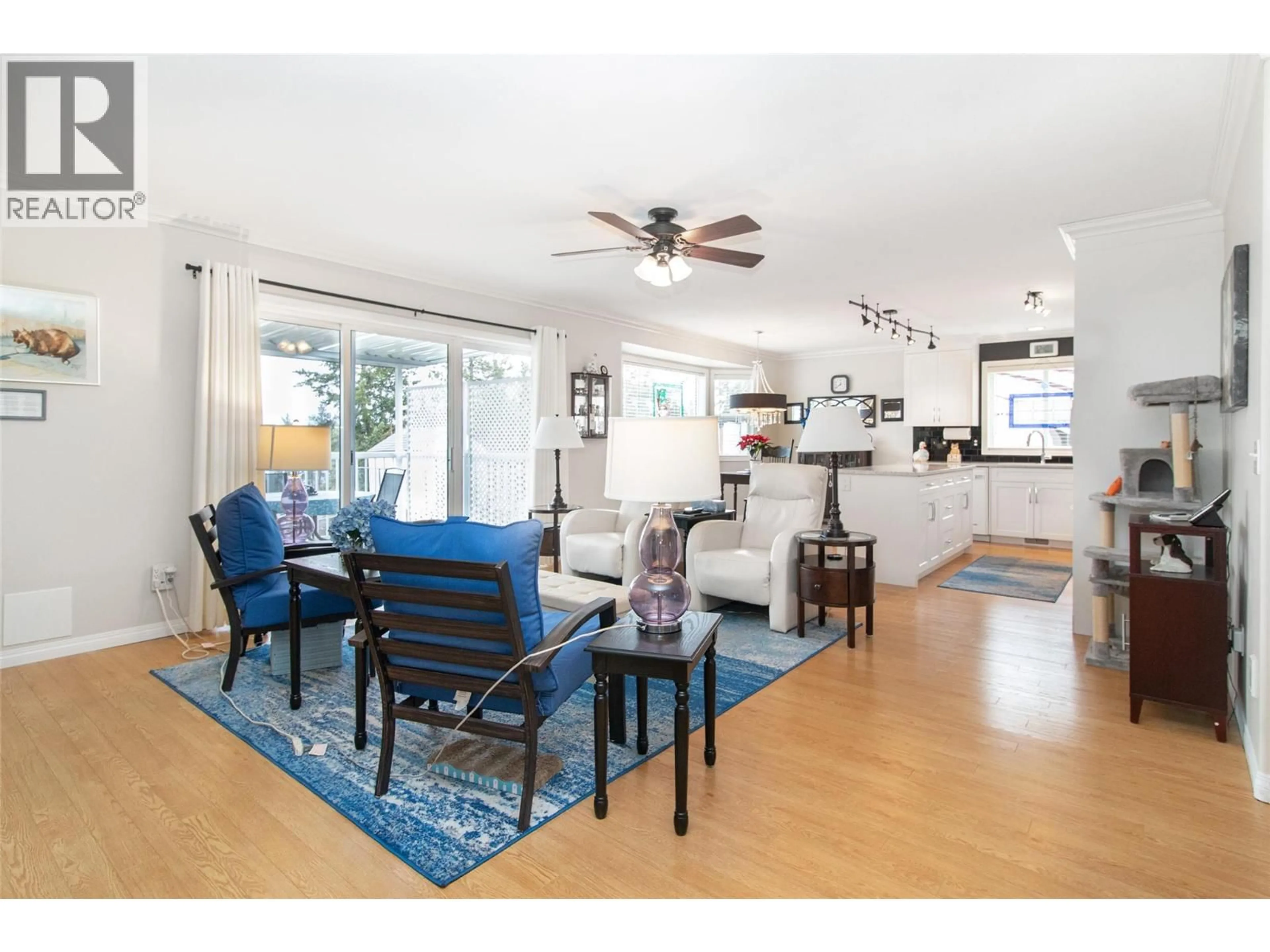 Living room with furniture, wood/laminate floor for 3527 GLEN EAGLES DRIVE, West Kelowna British Columbia V4T2L6