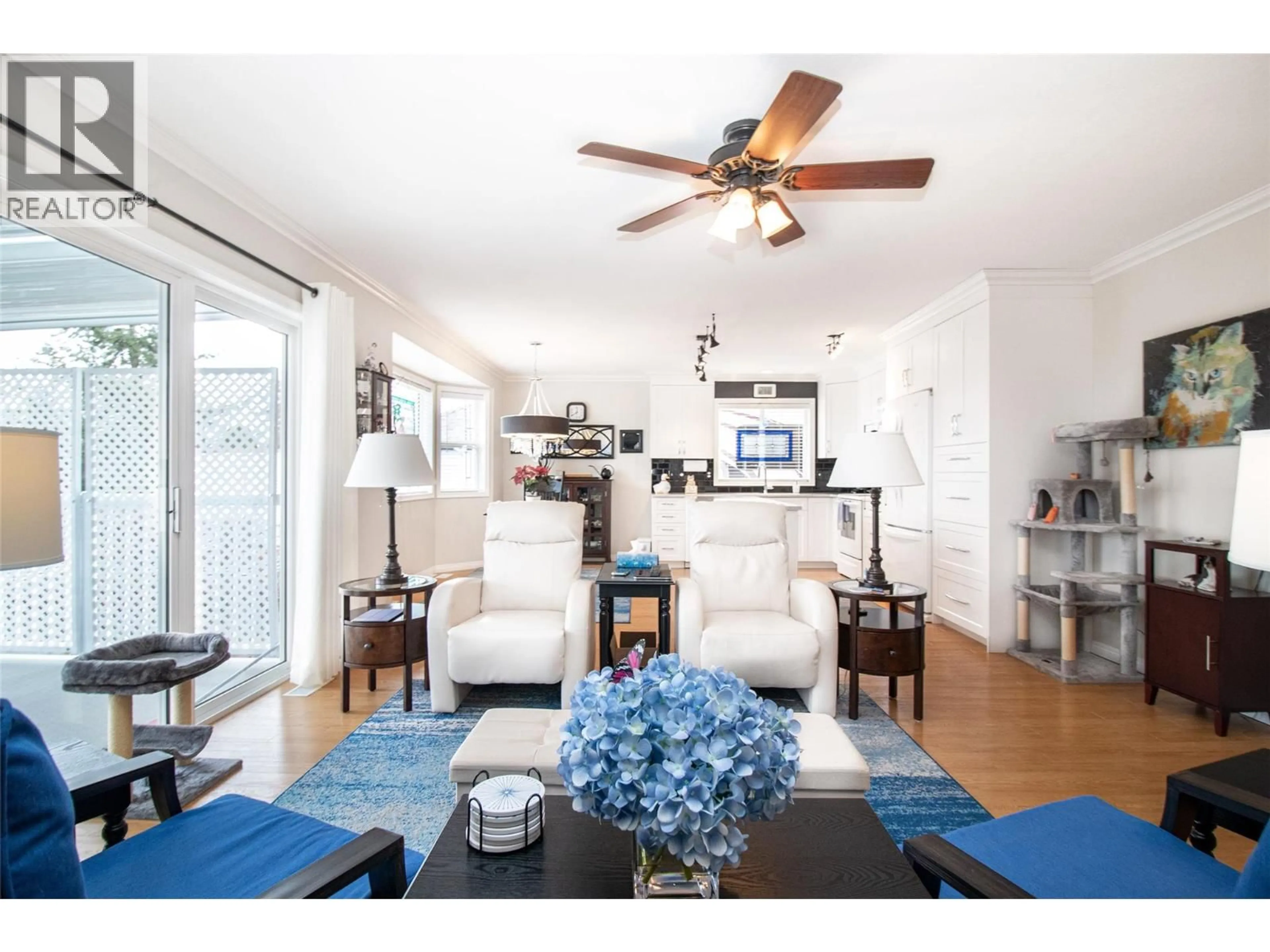 Living room with furniture, wood/laminate floor for 3527 GLEN EAGLES DRIVE, West Kelowna British Columbia V4T2L6