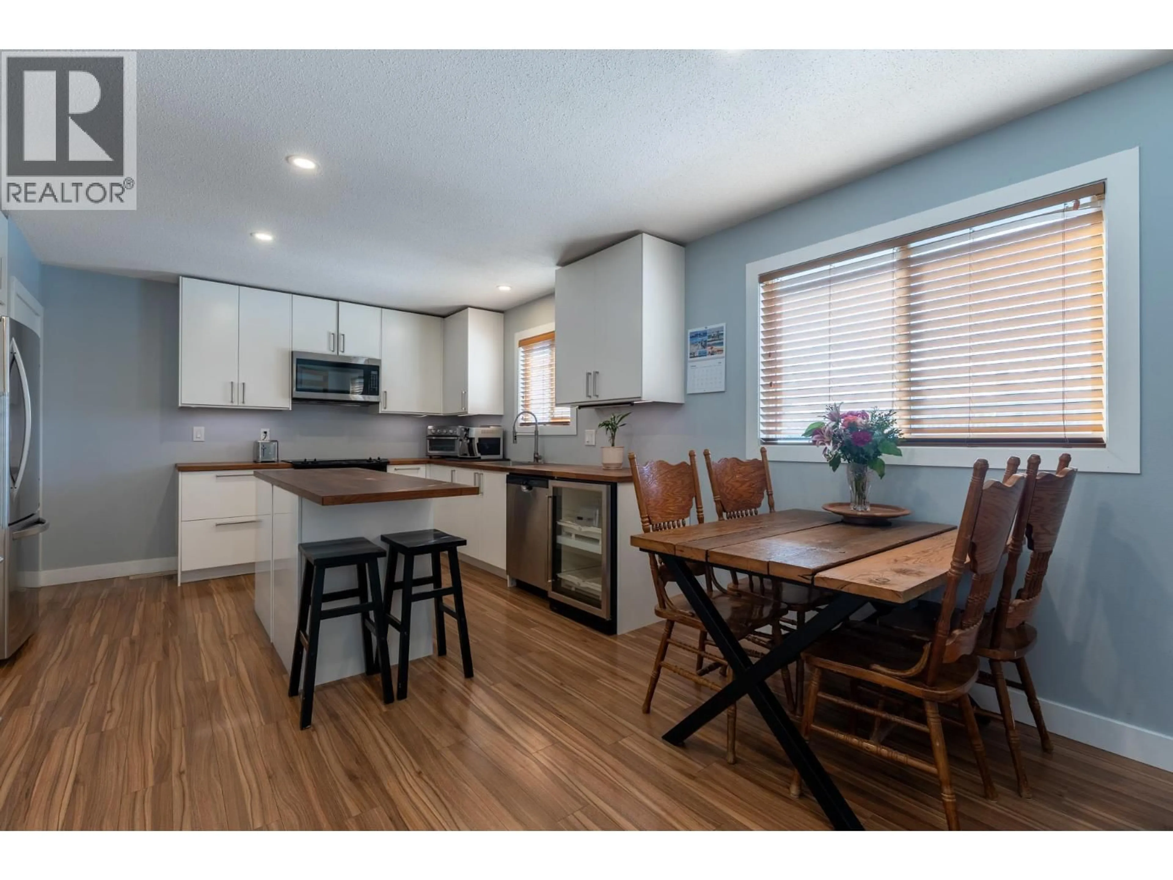 Open concept kitchen, wood/laminate floor for 490 MALLACH ROAD, Kelowna British Columbia V1X2W3