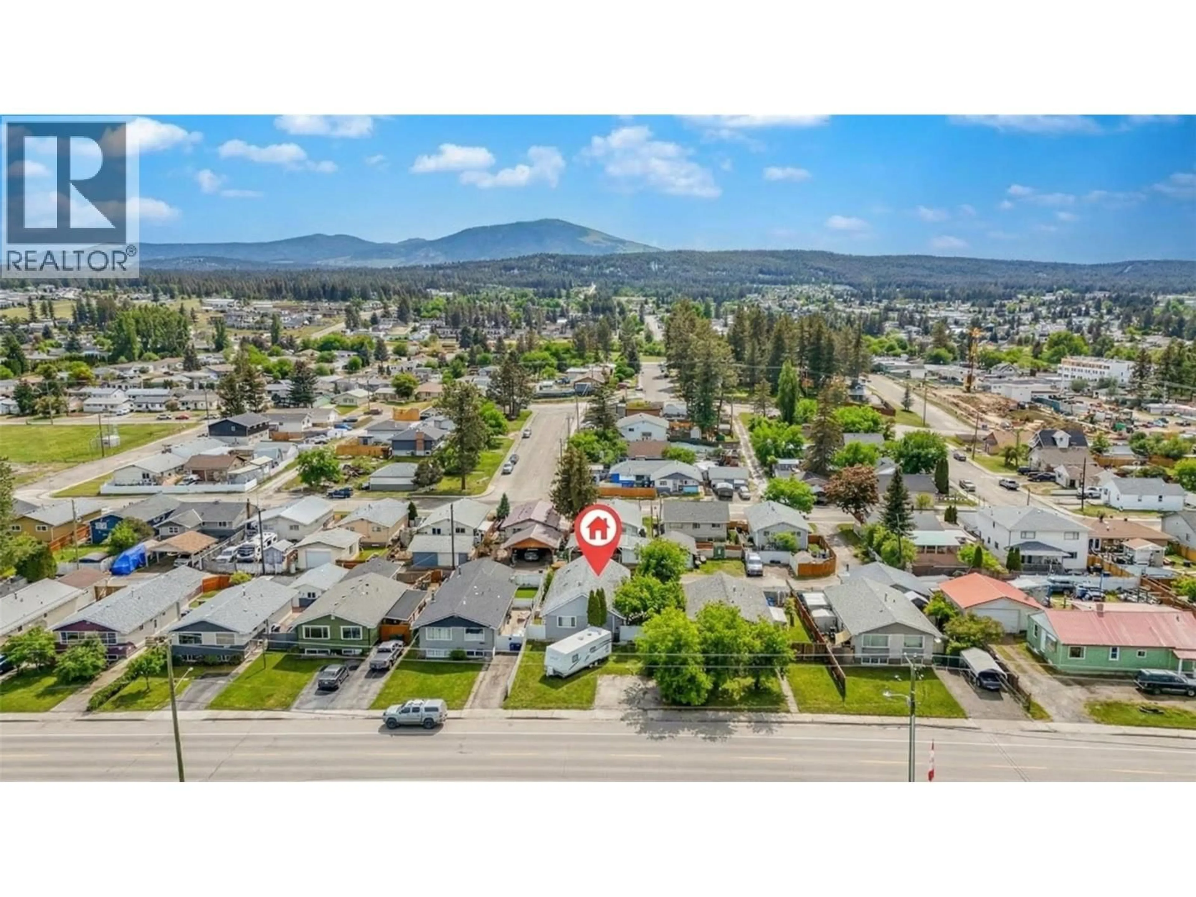 A pic from outside/outdoor area/front of a property/back of a property/a pic from drone, mountain view for 1815 2ND STREET SOUTH, Cranbrook British Columbia V1C1C6