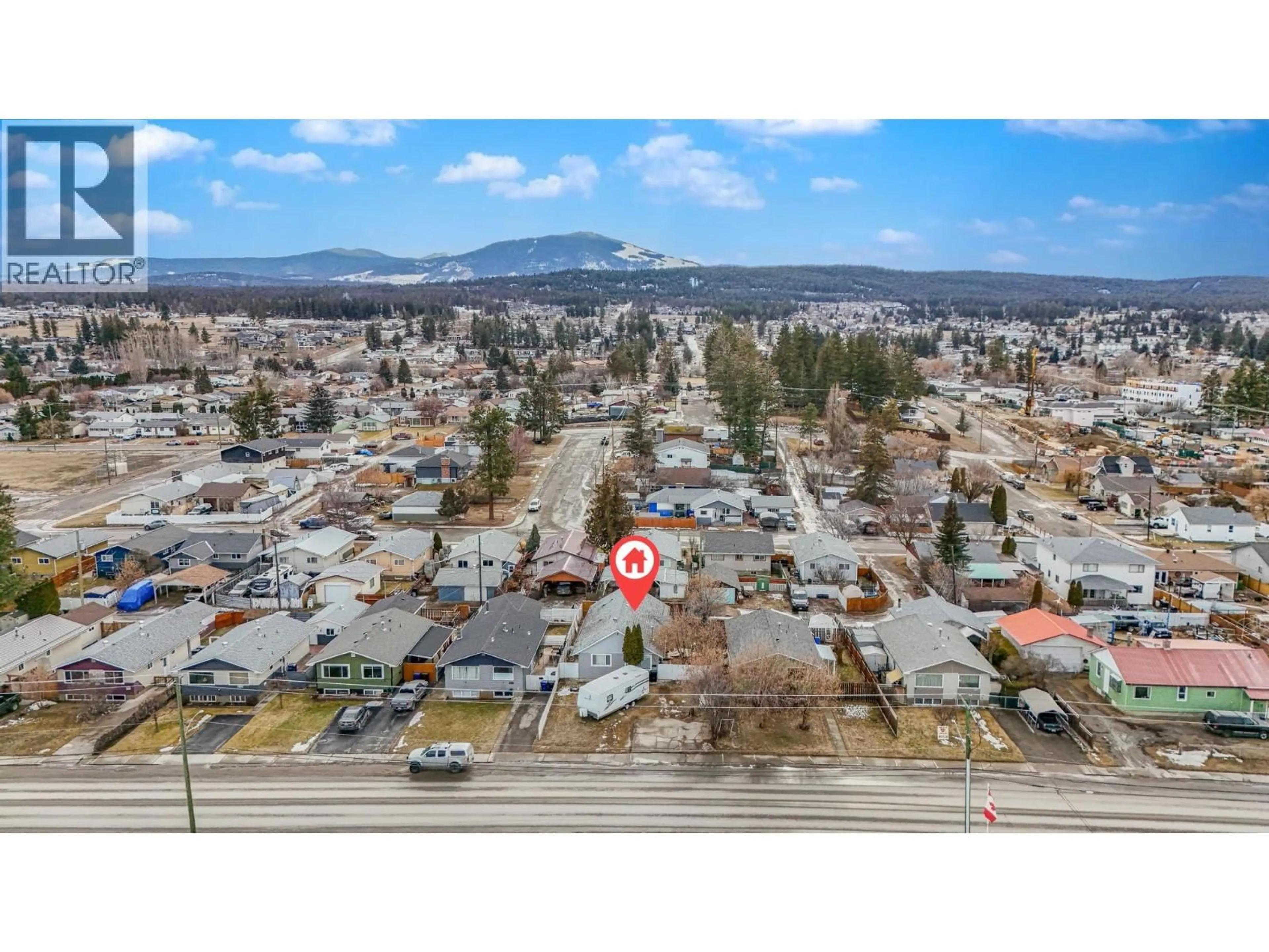 A pic from outside/outdoor area/front of a property/back of a property/a pic from drone, mountain view for 1815 2ND STREET SOUTH, Cranbrook British Columbia V1C1C6