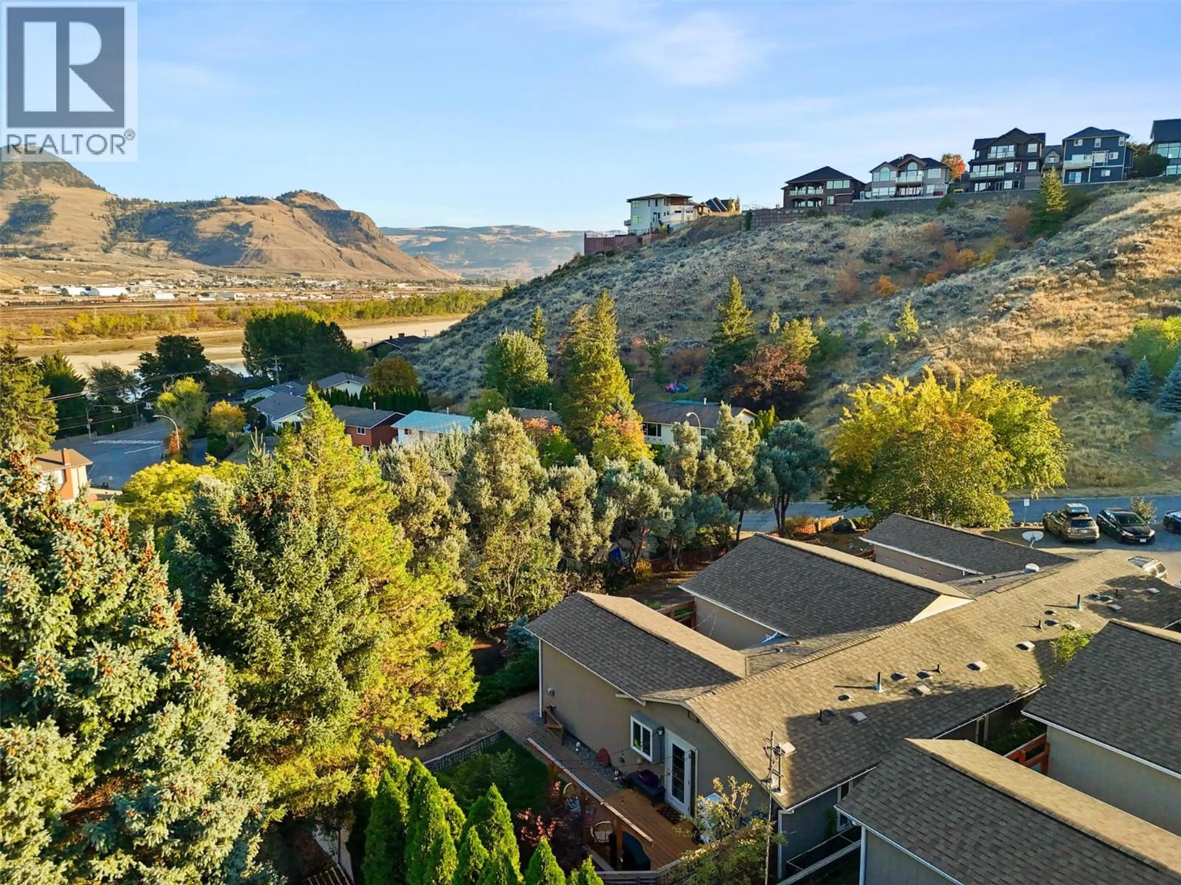 A pic from outside/outdoor area/front of a property/back of a property/a pic from drone, mountain view for 104 - 870 MCQUEEN DRIVE, Kamloops British Columbia V2B7X9