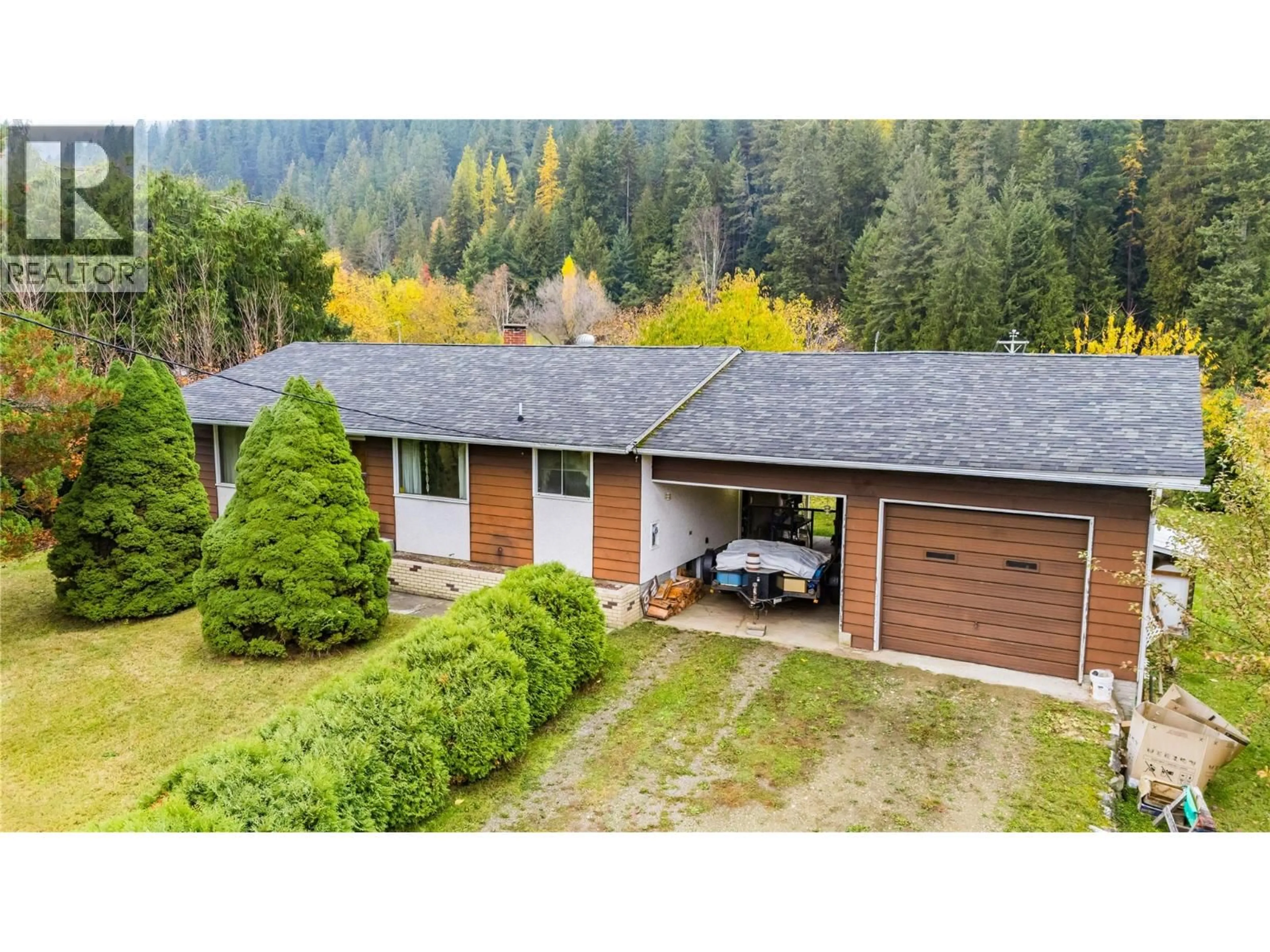 A pic from outside/outdoor area/front of a property/back of a property/a pic from drone, forest/trees view for 1535 HIGHWAY 3A HIGHWAY, Thrums British Columbia V1N4M7