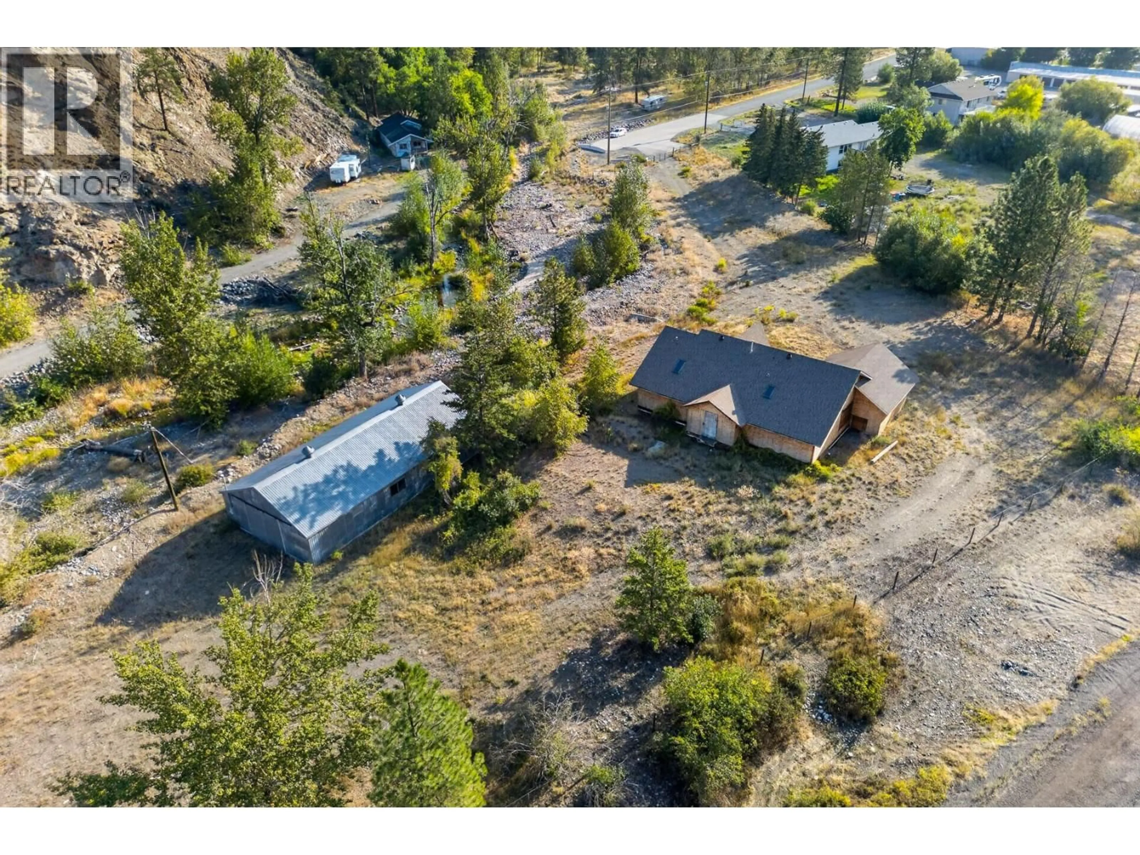 A pic from outside/outdoor area/front of a property/back of a property/a pic from drone, unknown for 390 MARSHALL ROAD, Merritt British Columbia V1K1N4
