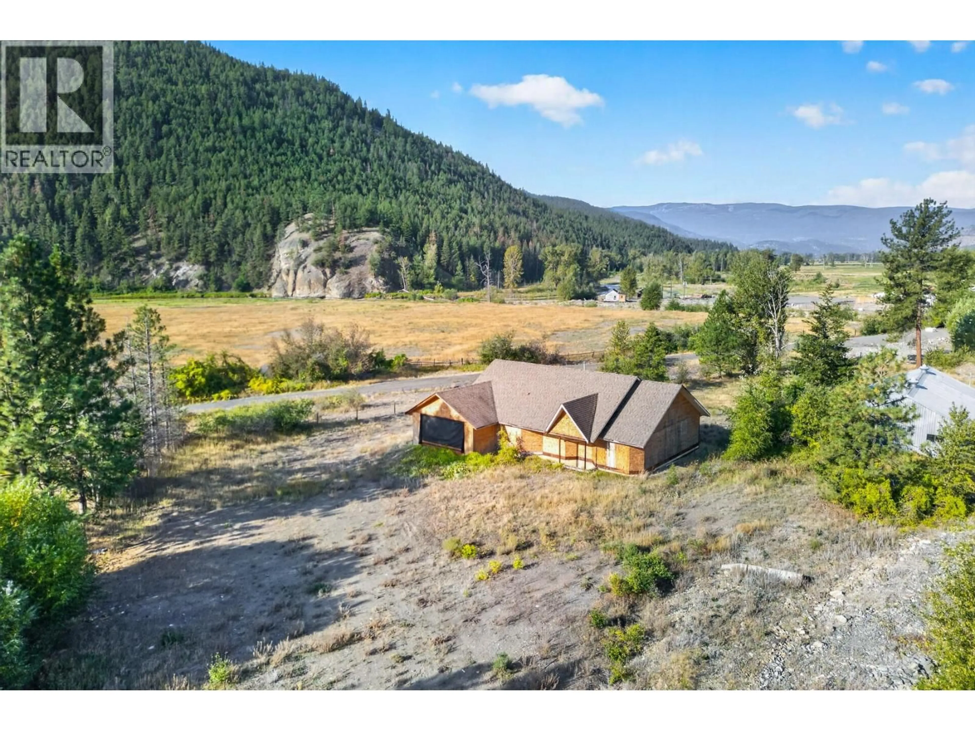 A pic from outside/outdoor area/front of a property/back of a property/a pic from drone, mountain view for 390 MARSHALL ROAD, Merritt British Columbia V1K1N4