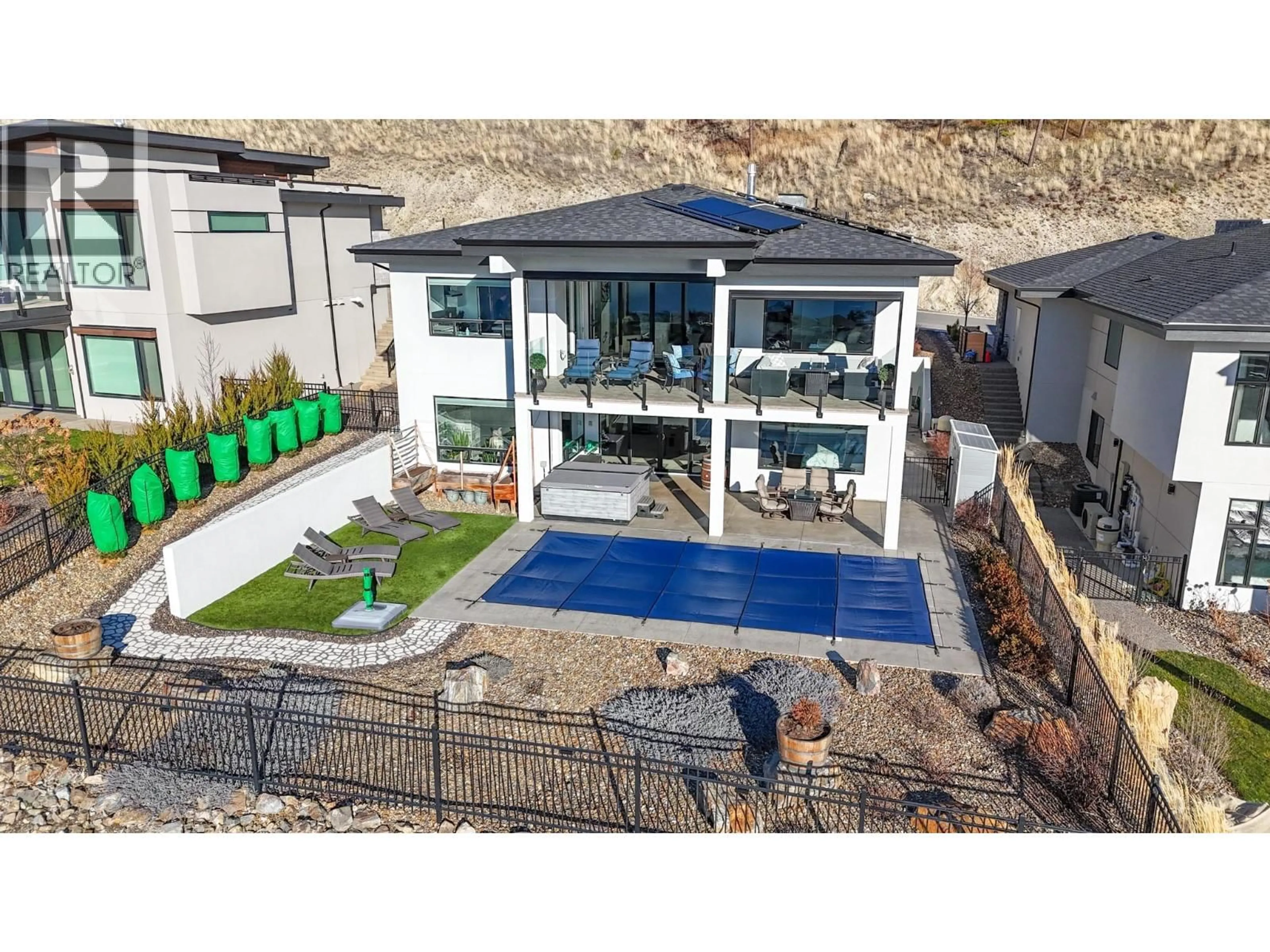 A pic from outside/outdoor area/front of a property/back of a property/a pic from drone, mountain view for 9882 BEACON HILL DRIVE, Lake Country British Columbia V4V0A9